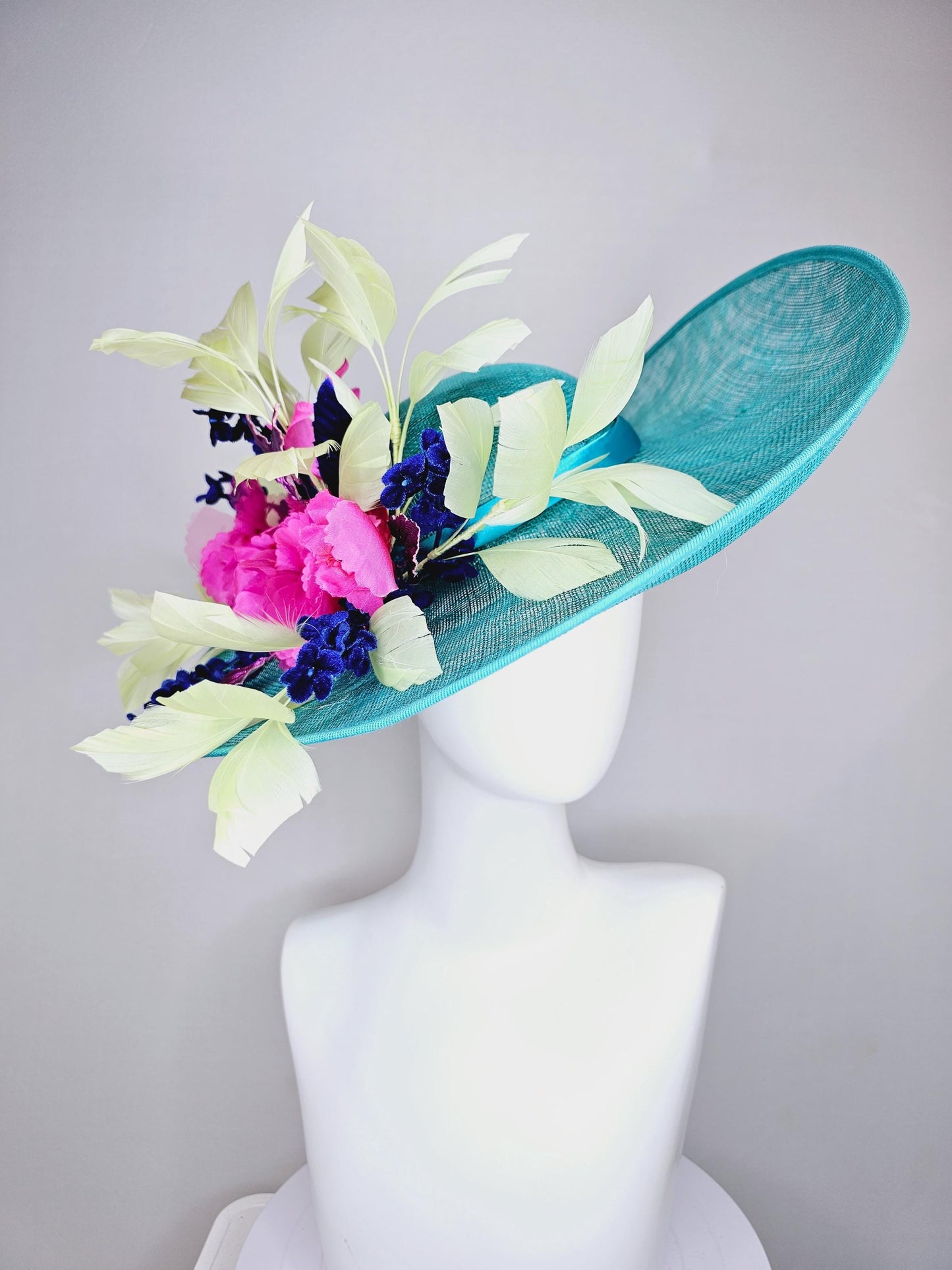 kentucky derby hat large wide brim sinamay turquoise blue hat hot pink silk flowers,mint green feathers,purple leaves navy blue flower stems