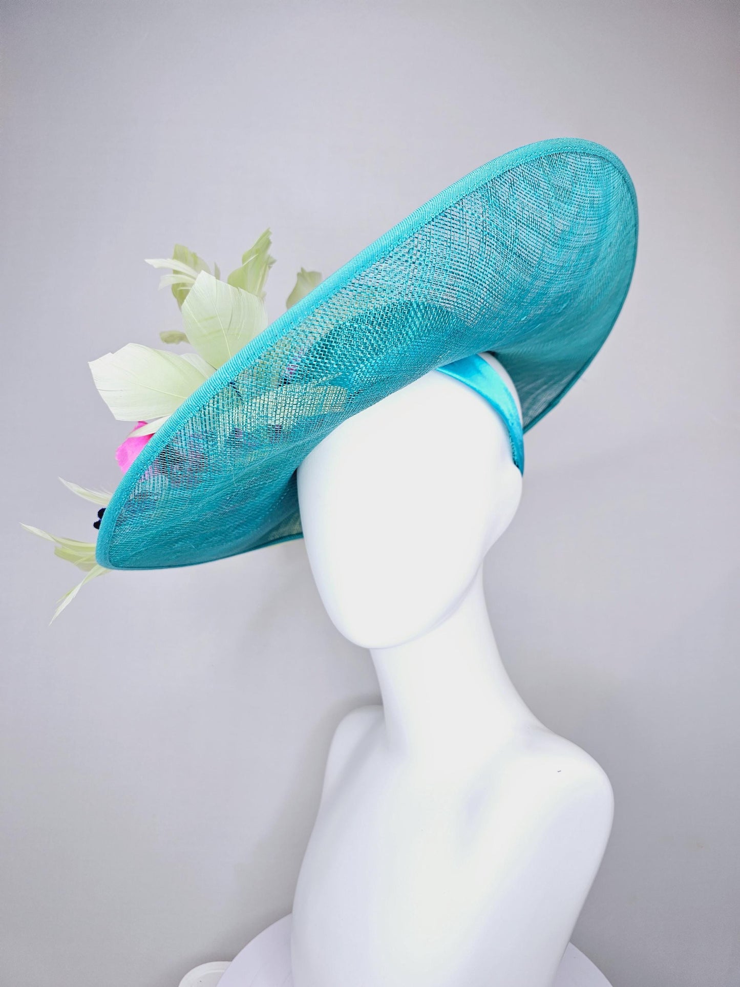 kentucky derby hat large wide brim sinamay turquoise blue hat hot pink silk flowers,mint green feathers,purple leaves navy blue flower stems