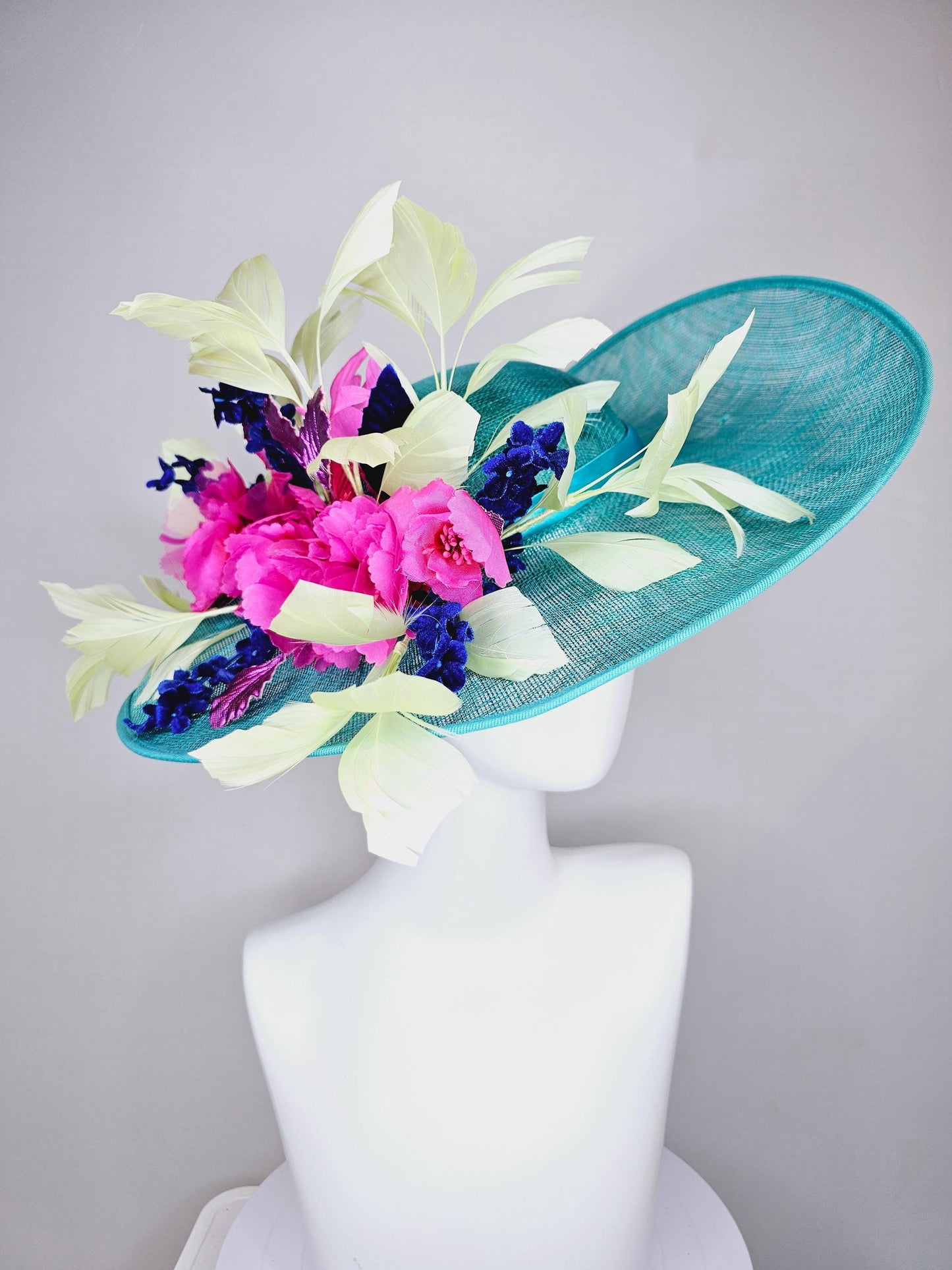 kentucky derby hat large wide brim sinamay turquoise blue hat hot pink silk flowers,mint green feathers,purple leaves navy blue flower stems