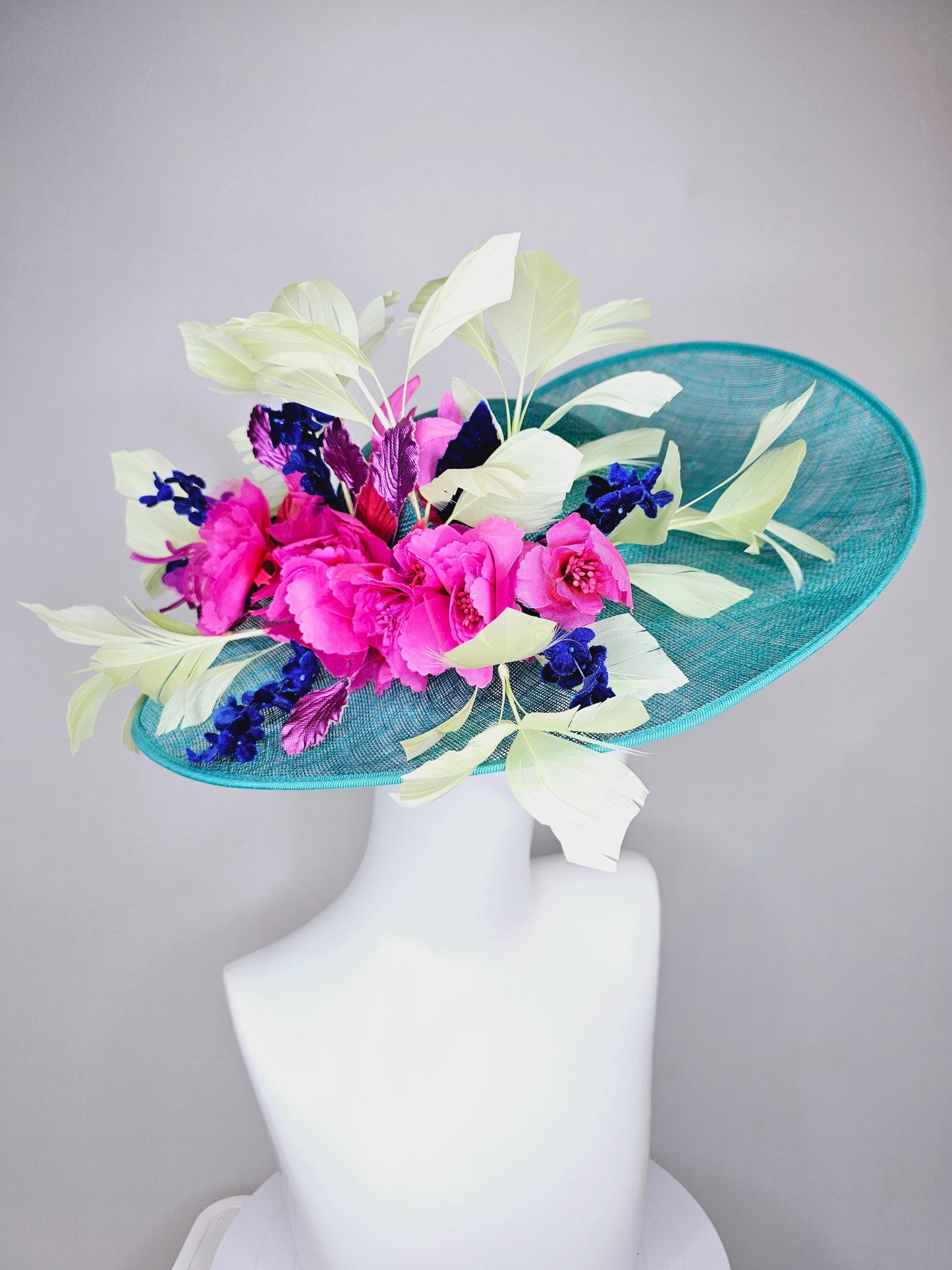 kentucky derby hat large wide brim sinamay turquoise blue hat hot pink silk flowers,mint green feathers,purple leaves navy blue flower stems