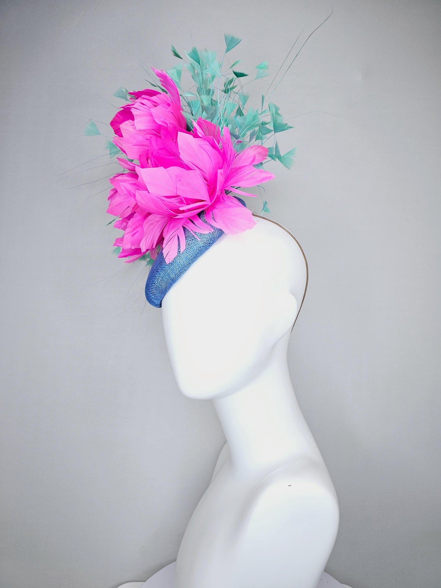 kentucky derby hat fascinator blue sinamay saucer with bright fuchsia hot pink feather flowers and mint green branching feathers