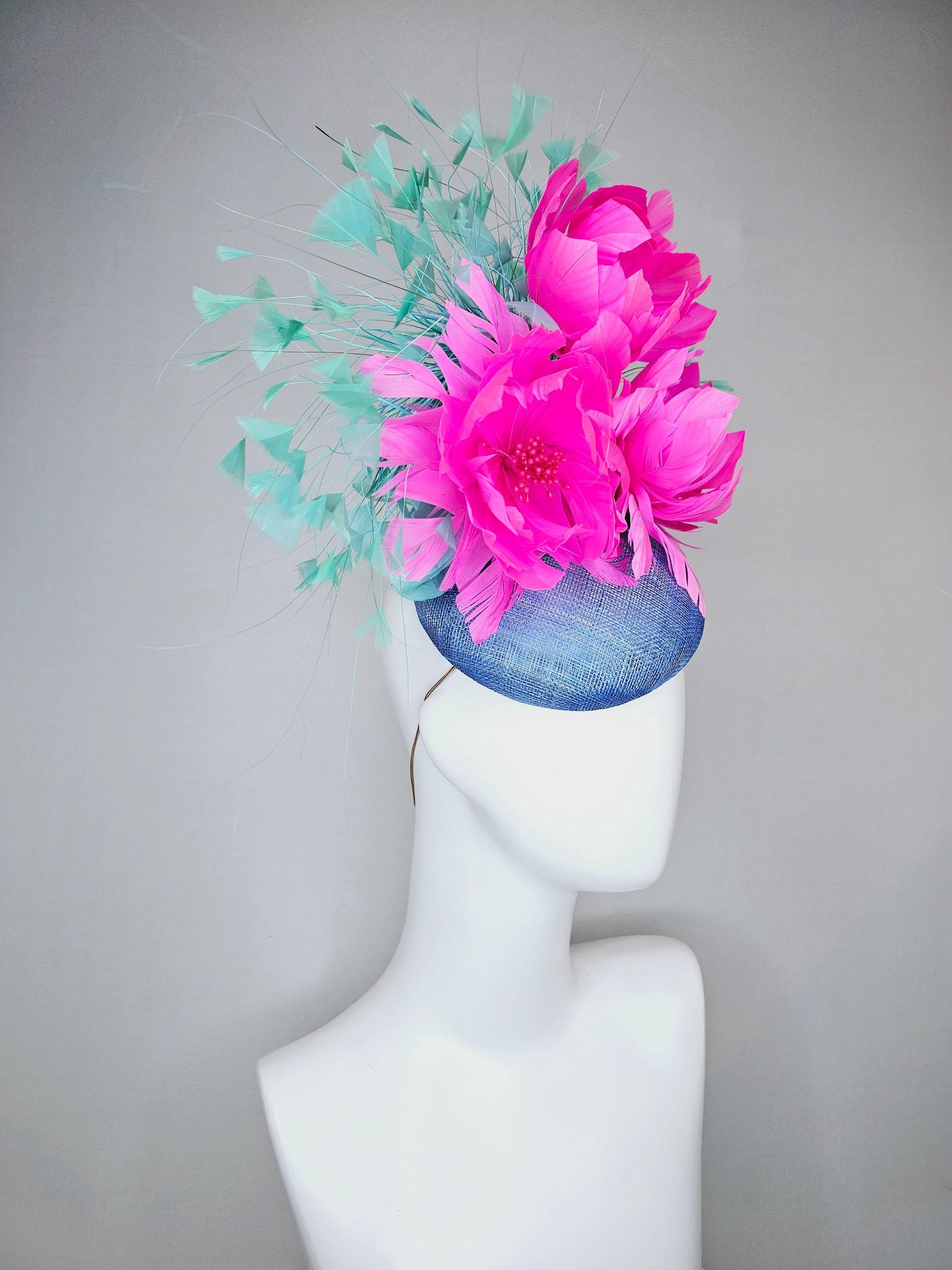 kentucky derby hat fascinator blue sinamay saucer with bright fuchsia hot pink feather flowers and mint green branching feathers