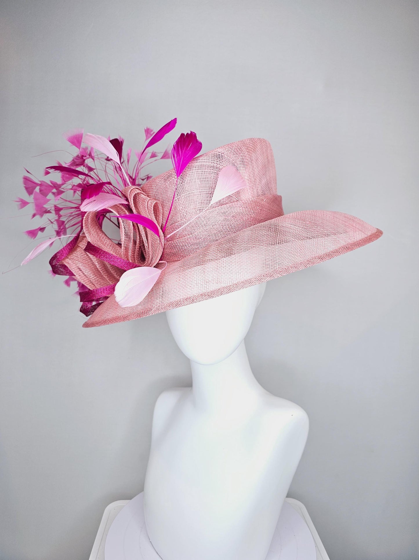 kentucky derby hat large wide brim sinamay light blush pink hat with fuchsia hot pink purple branching feathers and sinamay curls