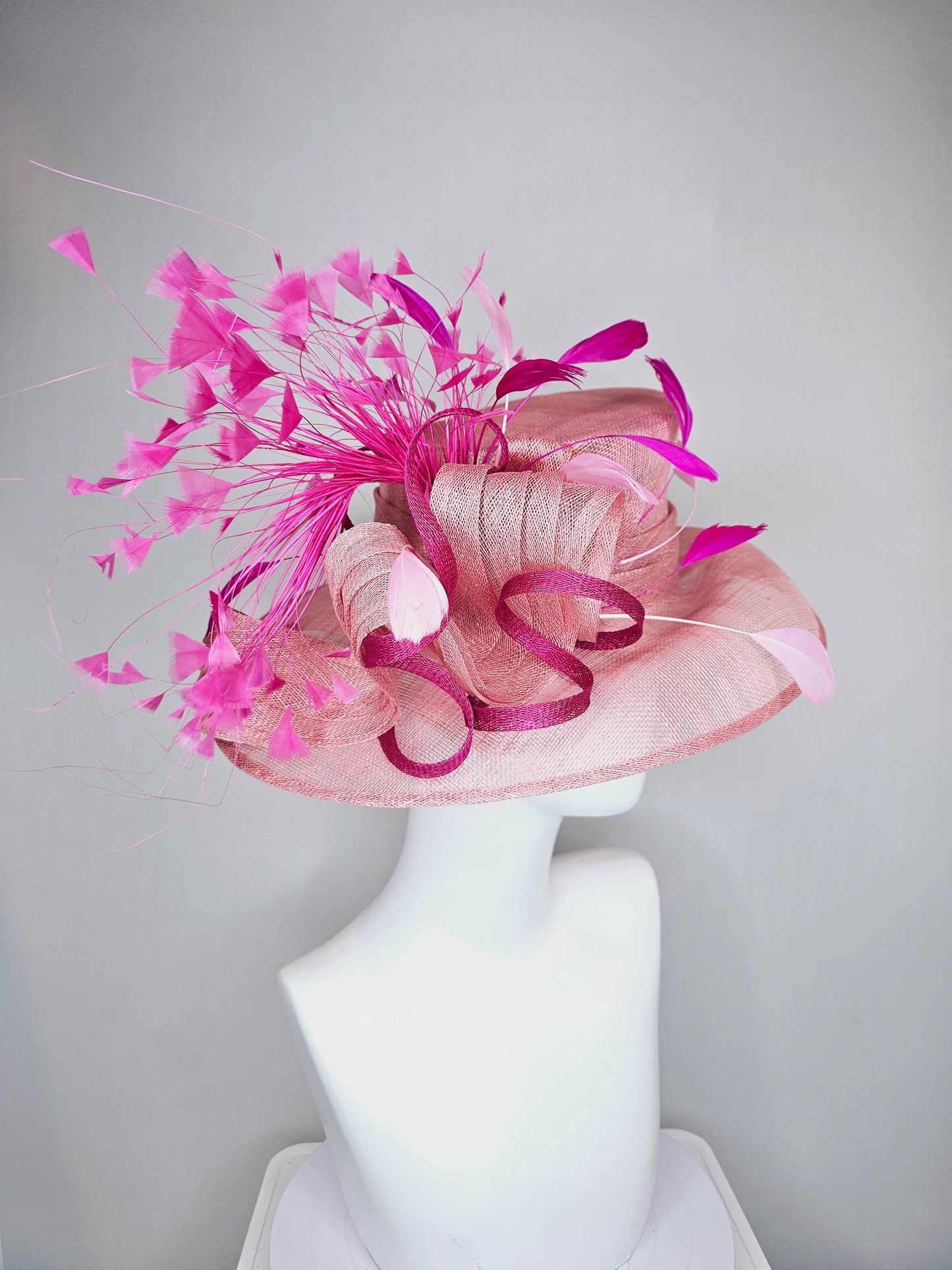 kentucky derby hat large wide brim sinamay light blush pink hat with fuchsia hot pink purple branching feathers and sinamay curls