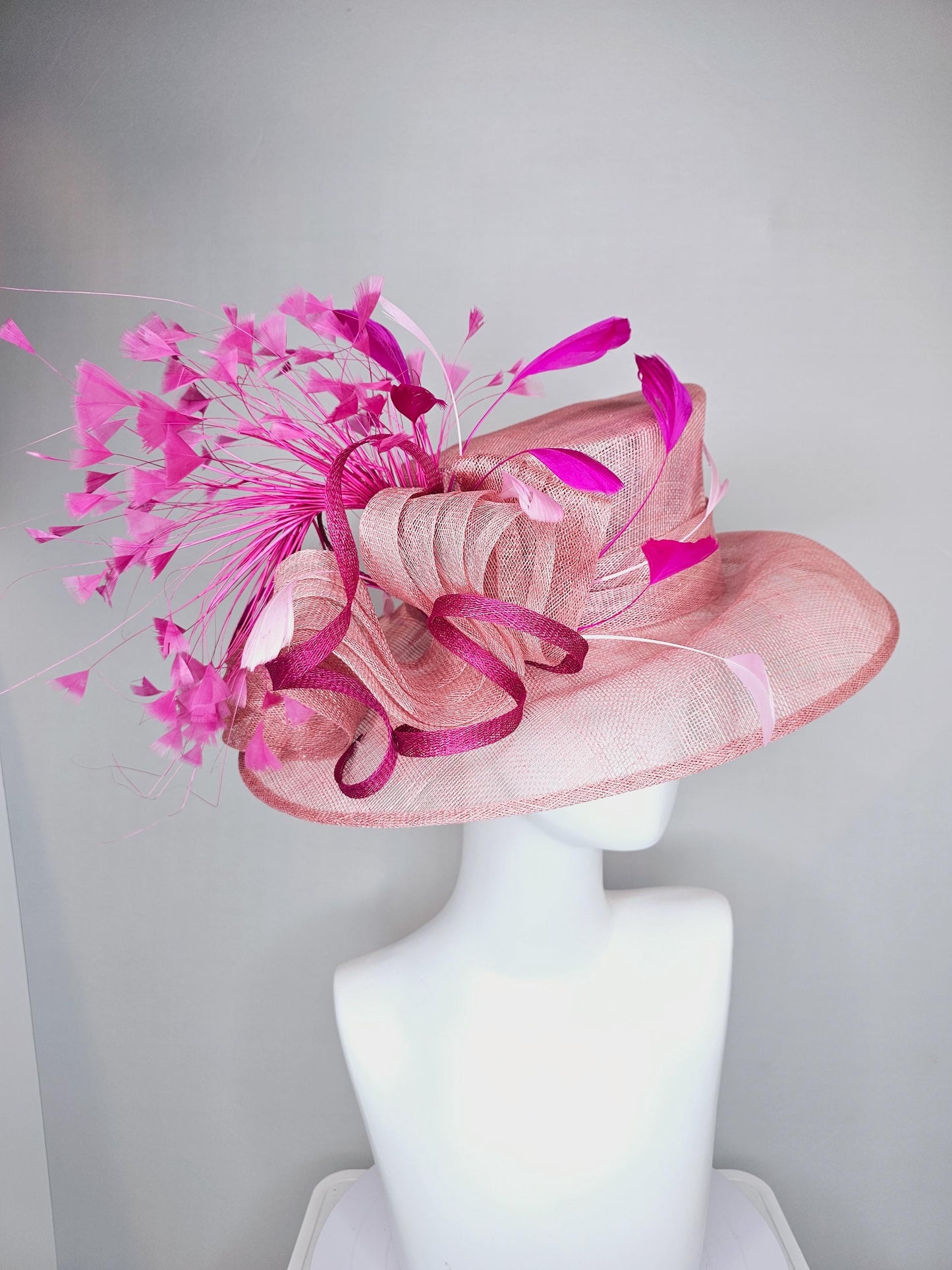 kentucky derby hat large wide brim sinamay light blush pink hat with fuchsia hot pink purple branching feathers and sinamay curls