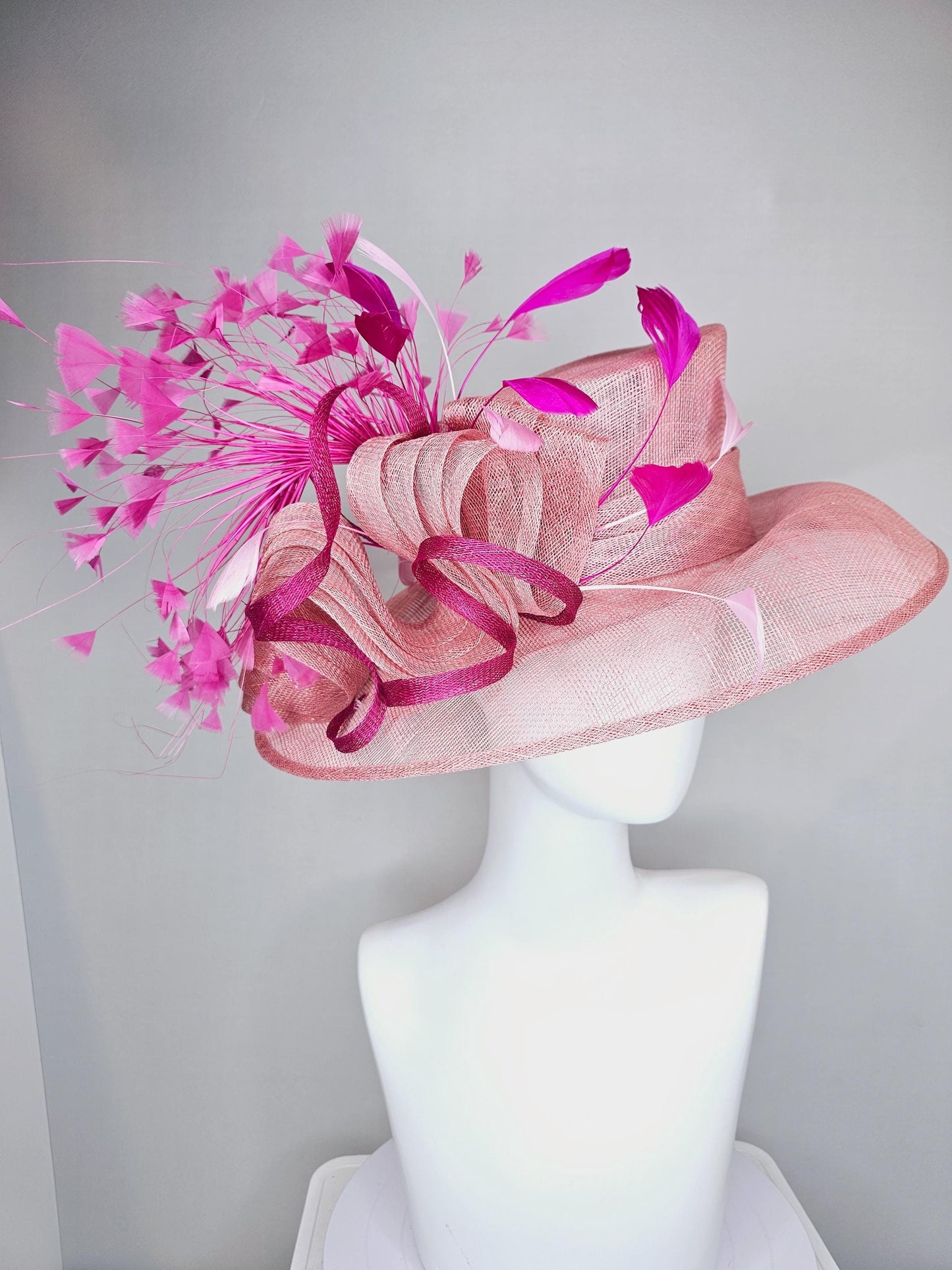 kentucky derby hat large wide brim sinamay light blush pink hat with fuchsia hot pink purple branching feathers and sinamay curls