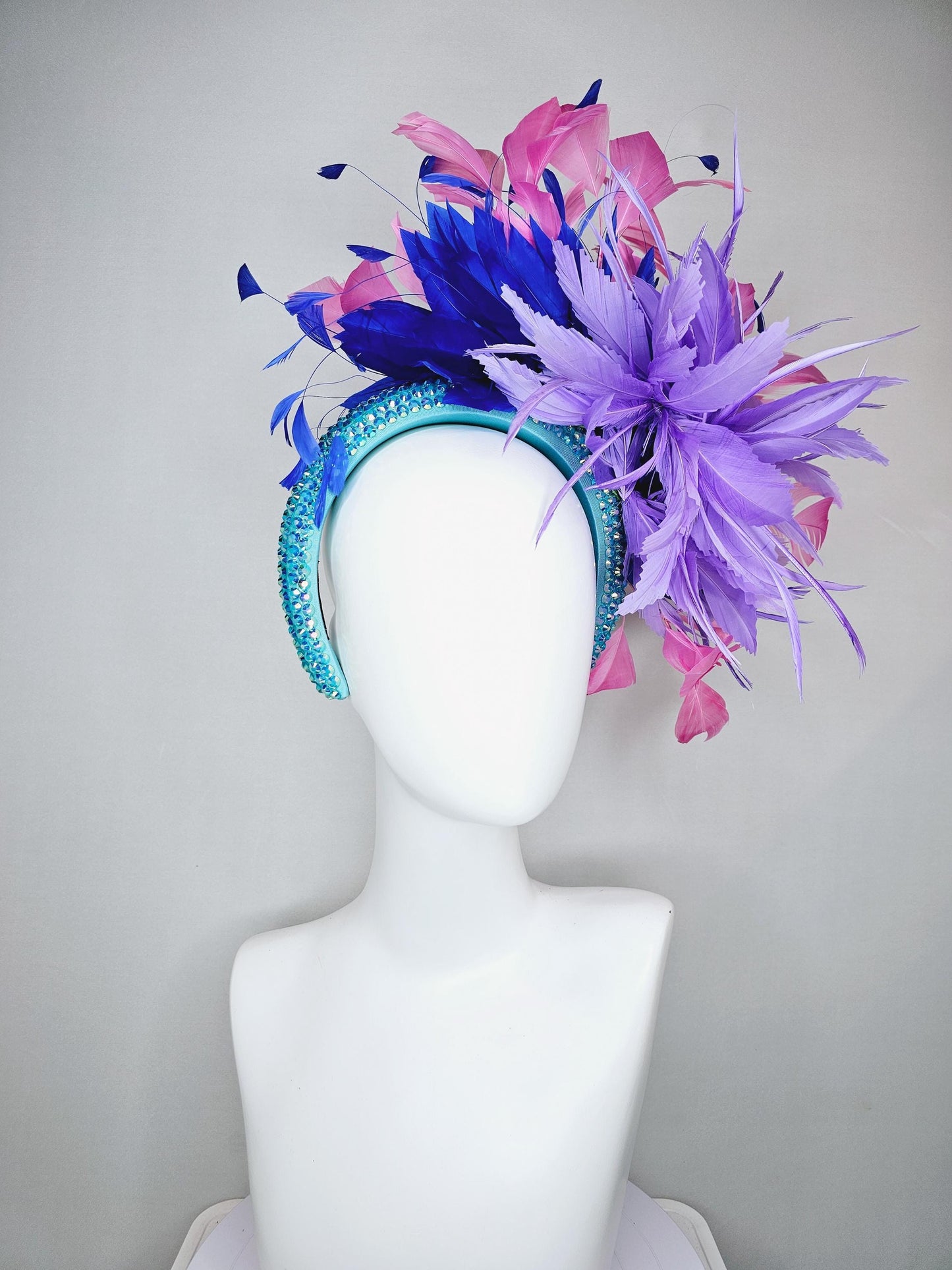 kentucky derby hat fascinator branching pink,royal blue,and purple lavender feathers on iridescent Swarovski crystal turquoise blue headband