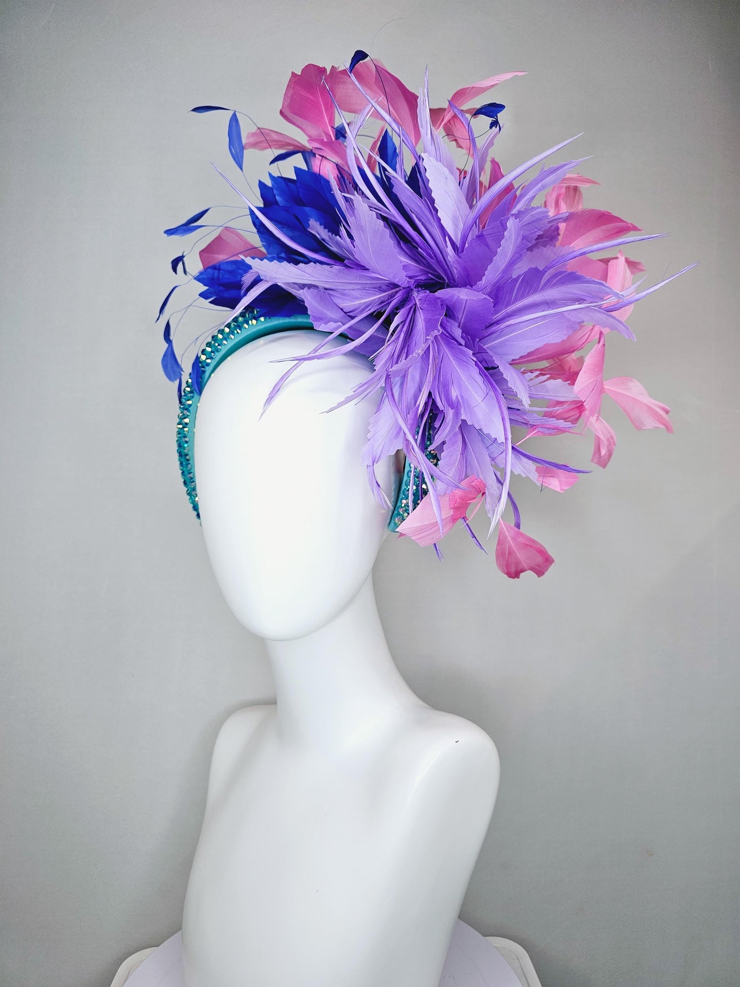 kentucky derby hat fascinator branching pink,royal blue,and purple lavender feathers on iridescent Swarovski crystal turquoise blue headband