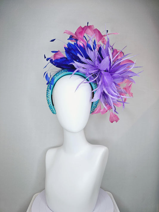 kentucky derby hat fascinator branching pink,royal blue,and purple lavender feathers on iridescent Swarovski crystal turquoise blue headband