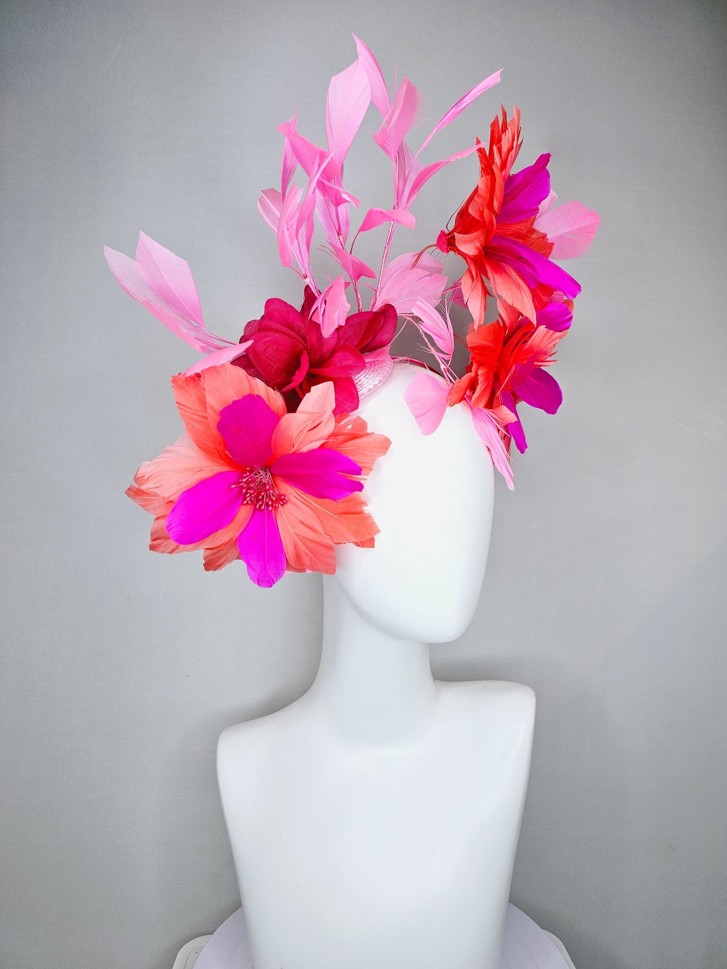 kentucky derby hat fascinator with fuchsia pink and coral orange feather flowers,and light pink branching feathers