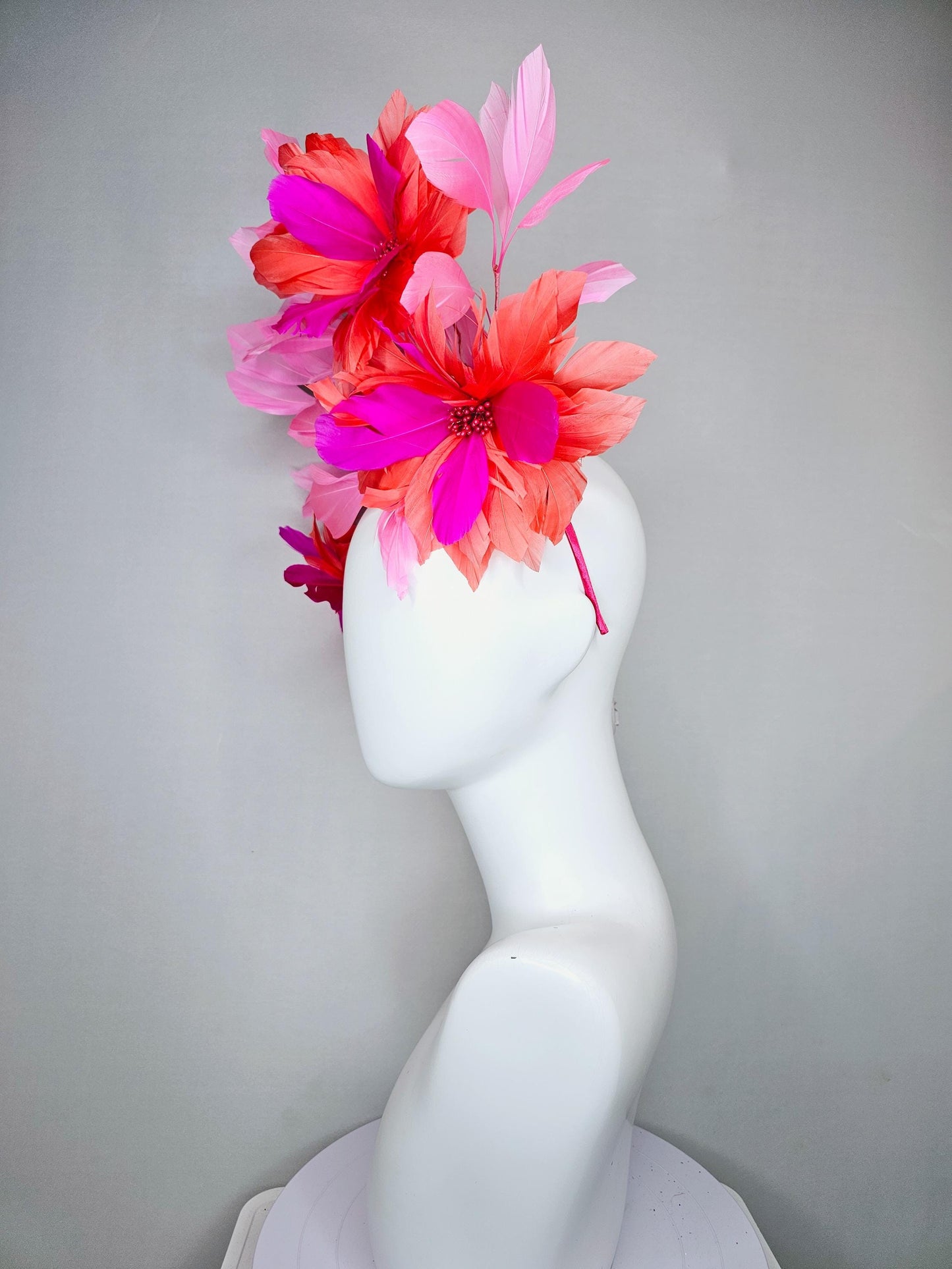 kentucky derby hat fascinator with fuchsia pink and coral orange feather flowers,and light pink branching feathers