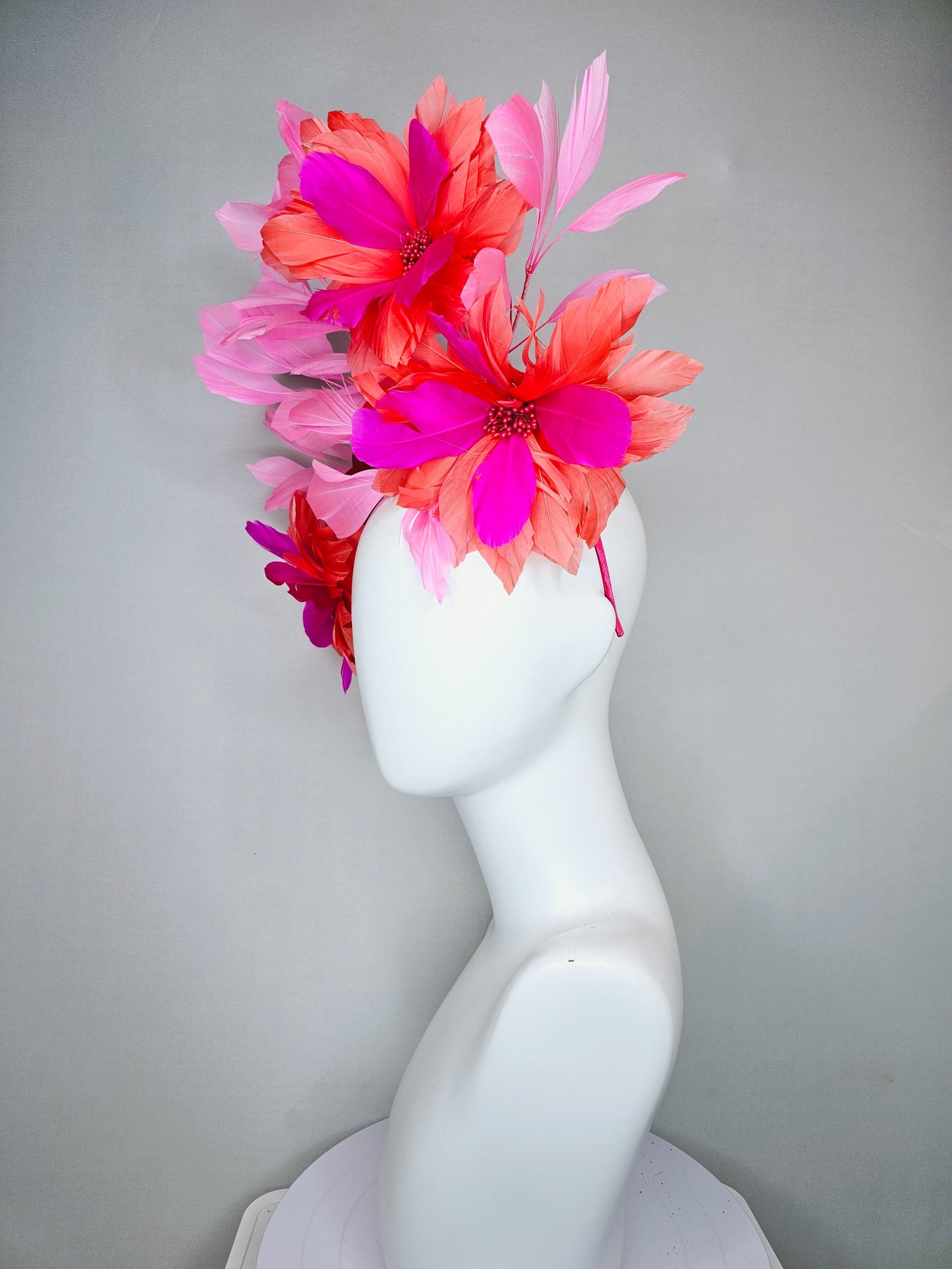 kentucky derby hat fascinator with fuchsia pink and coral orange feather flowers,and light pink branching feathers