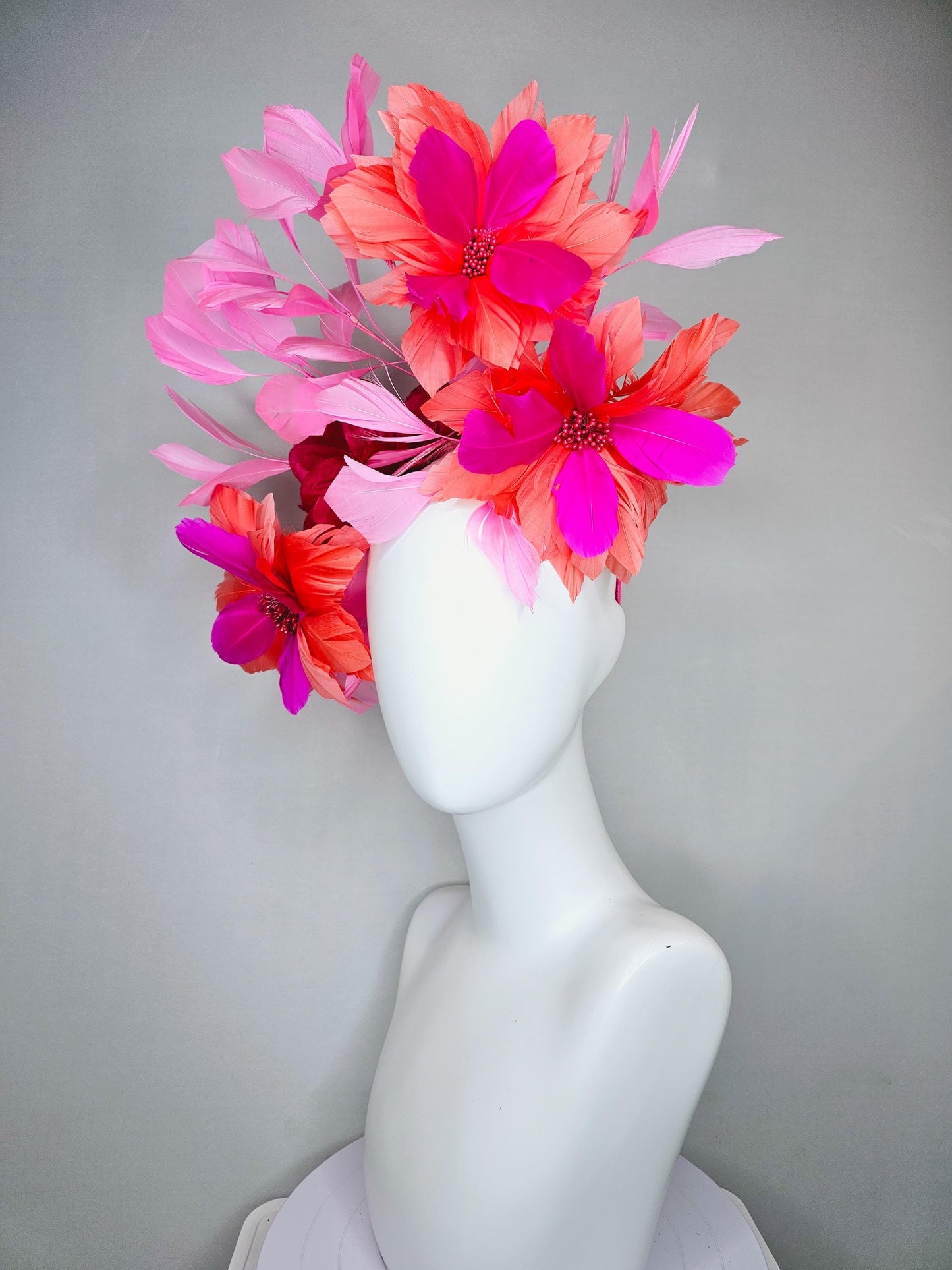 kentucky derby hat fascinator with fuchsia pink and coral orange feather flowers,and light pink branching feathers