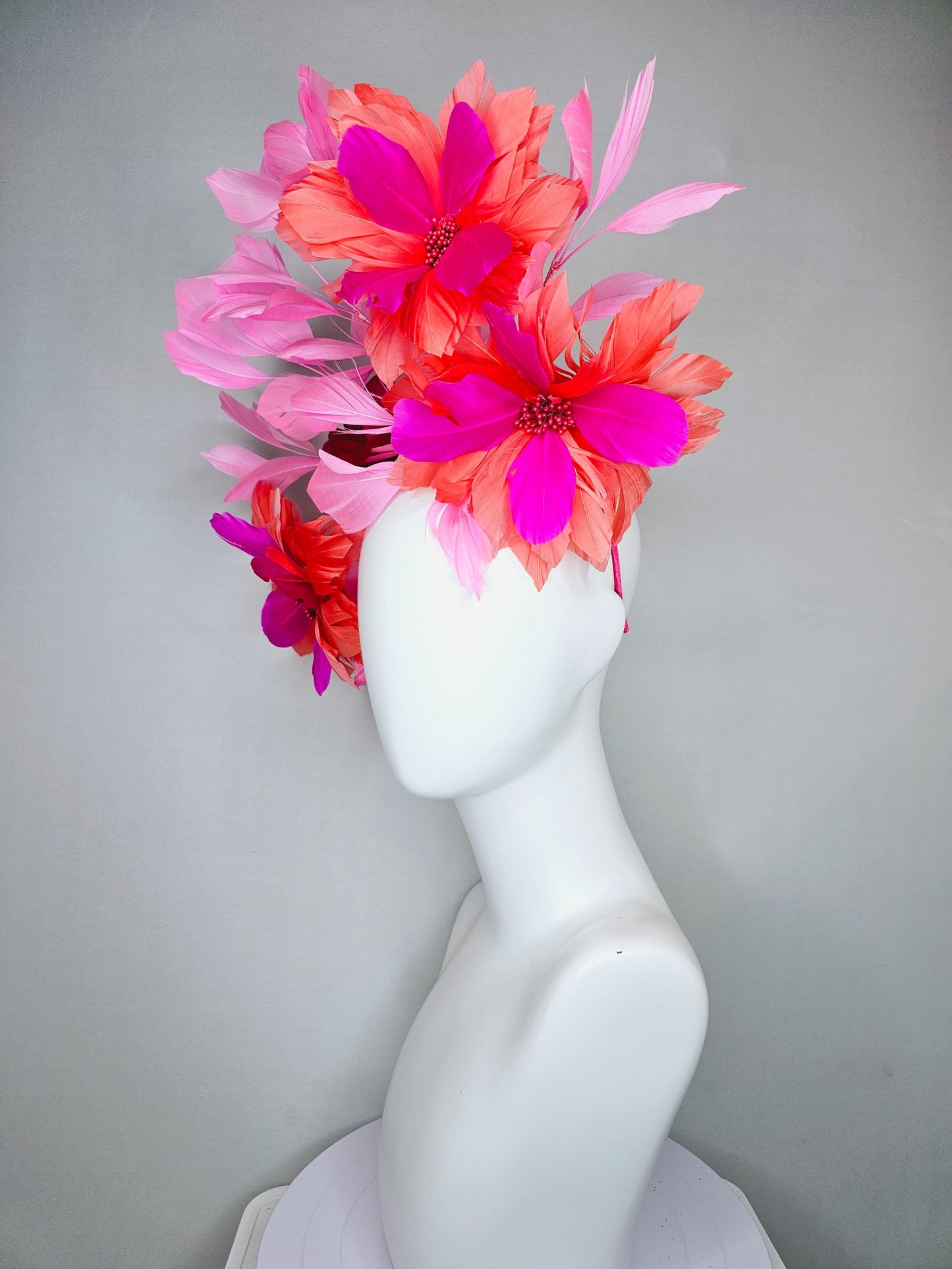 kentucky derby hat fascinator with fuchsia pink and coral orange feather flowers,and light pink branching feathers