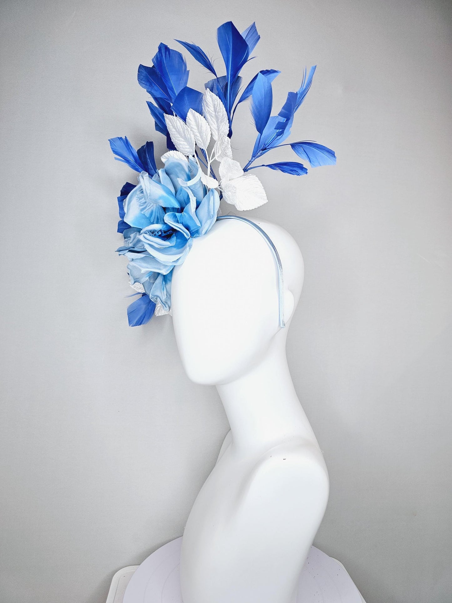 kentucky derby hat fascinator sky light blue satin silk flowers with white satin leaves and cobalt royal blue branching feathers