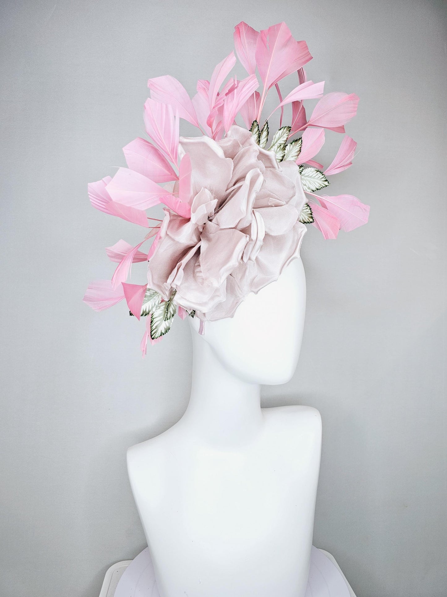 kentucky derby hat fascinator light dusty pink rose satin silk flower, white and green satin leaves and light baby pink branching feathers