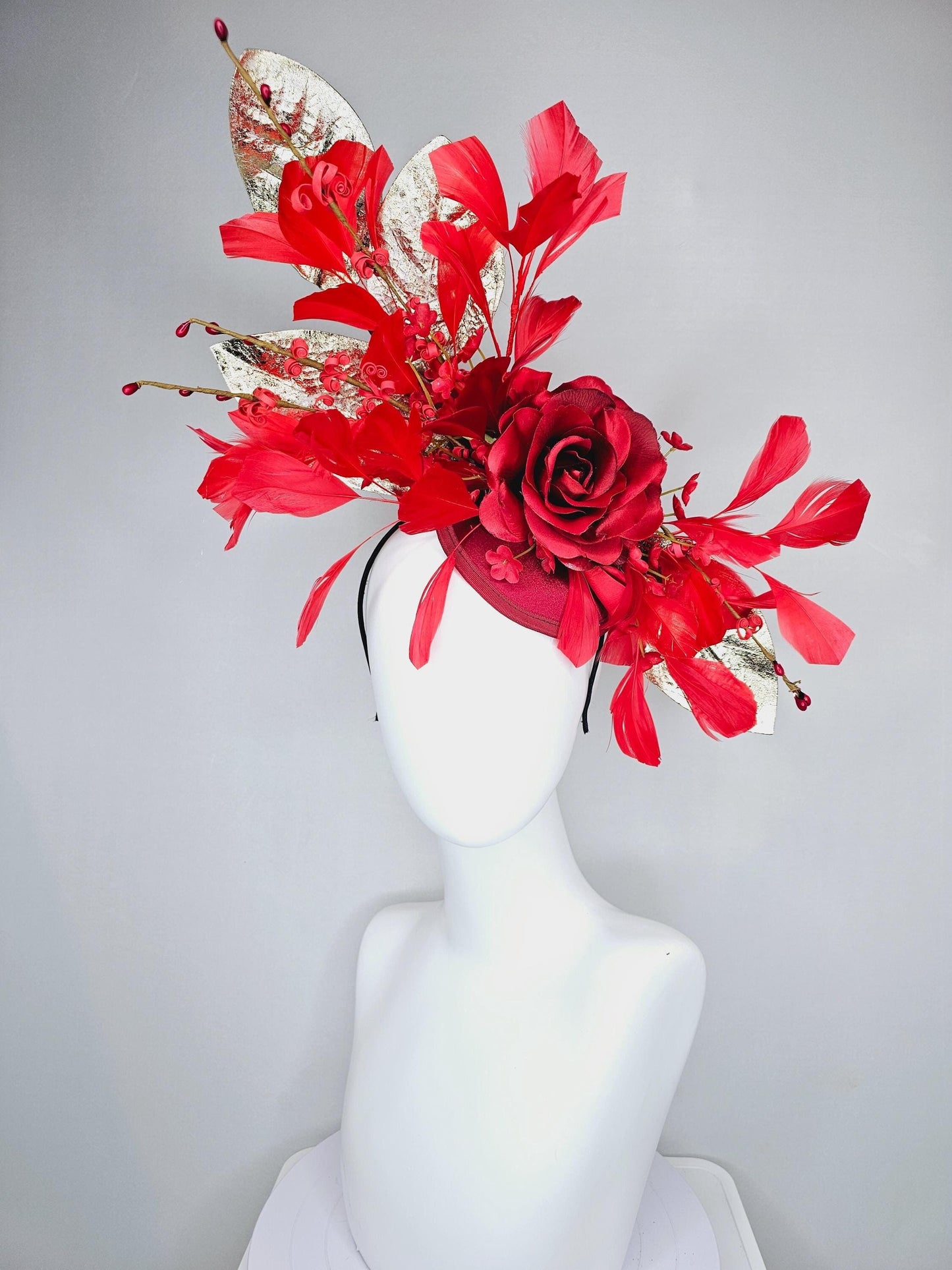 kentucky derby hat fascinator burgundy red satin with burgundy red satin rose flower, cherry red branching feathers, gold leaves and stems