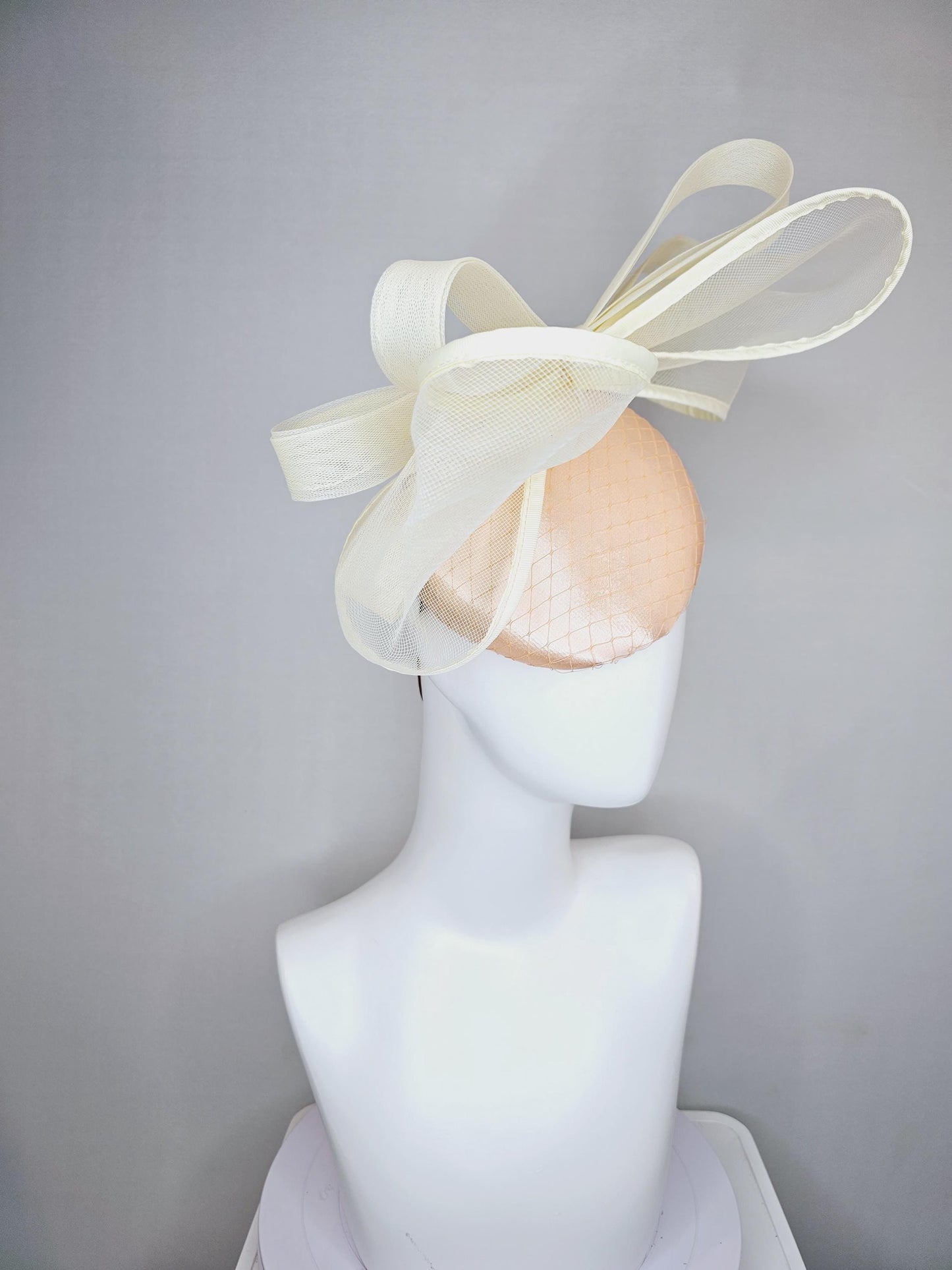 kentucky derby hat fascinator light pink satin with netting and large mesh neutral beige ivory bow