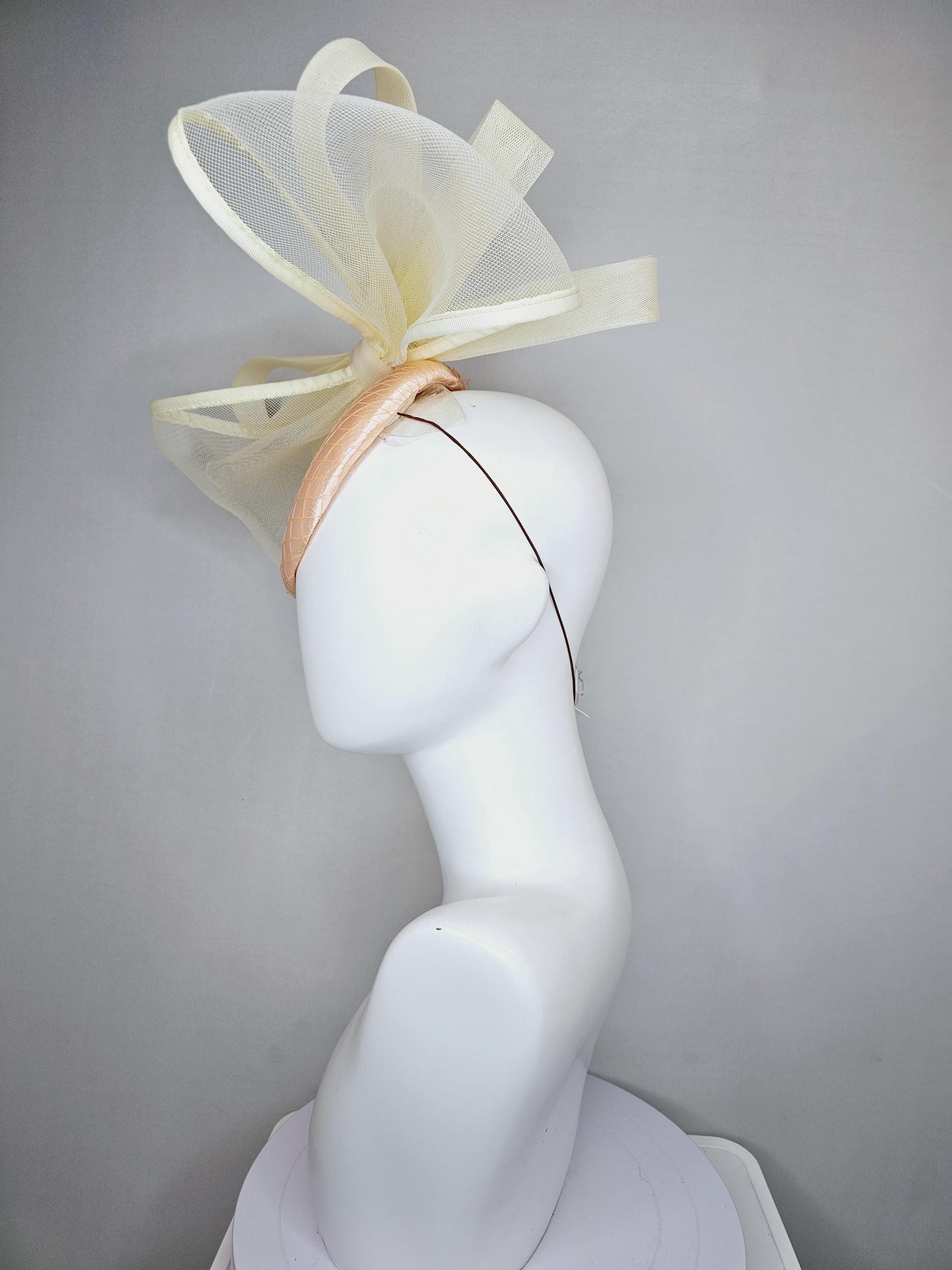 kentucky derby hat fascinator light pink satin with netting and large mesh neutral beige ivory bow