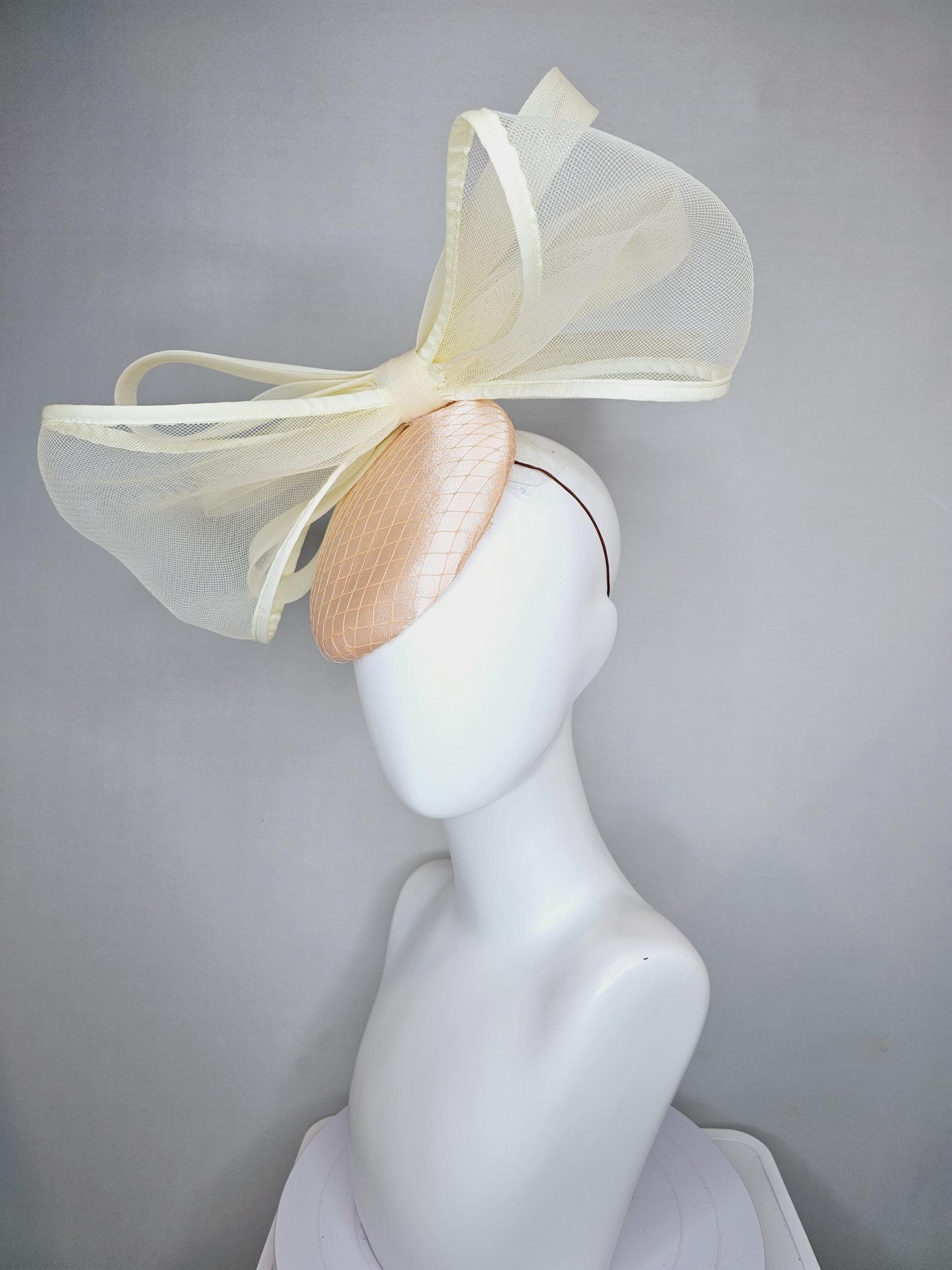 kentucky derby hat fascinator light pink satin with netting and large mesh neutral beige ivory bow