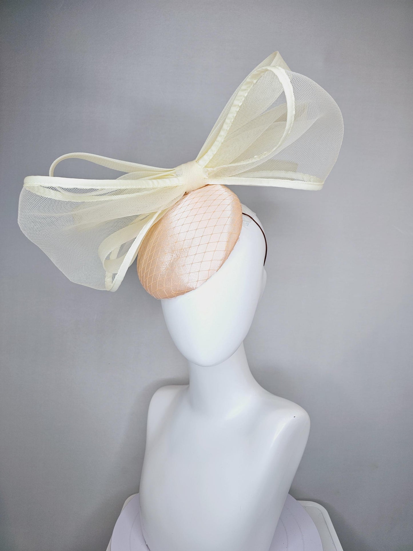 kentucky derby hat fascinator light pink satin with netting and large mesh neutral beige ivory bow