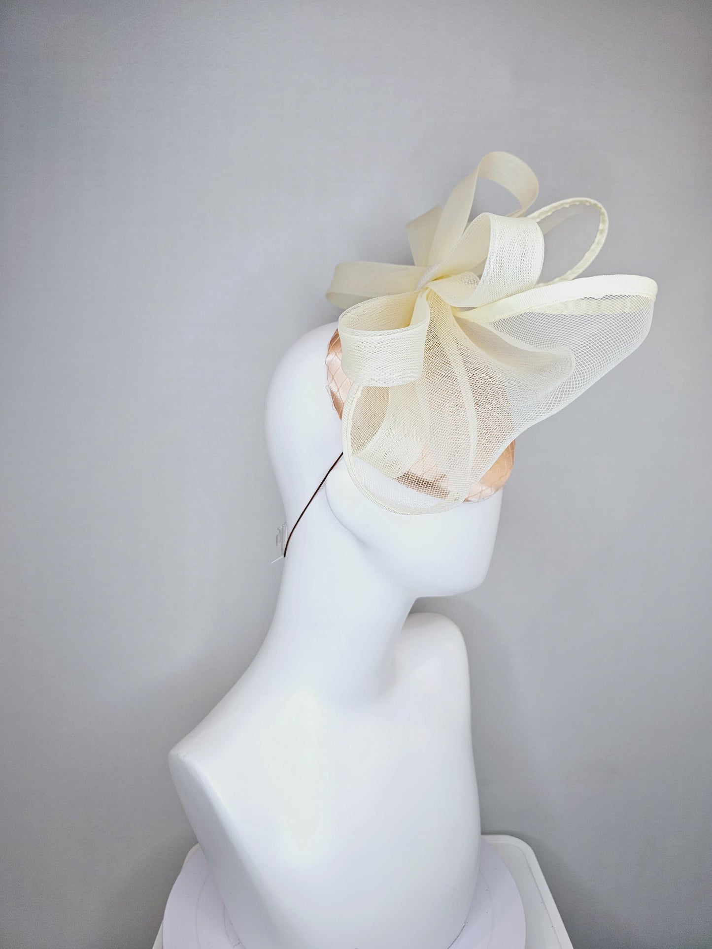 kentucky derby hat fascinator light pink satin with netting and large mesh neutral beige ivory bow