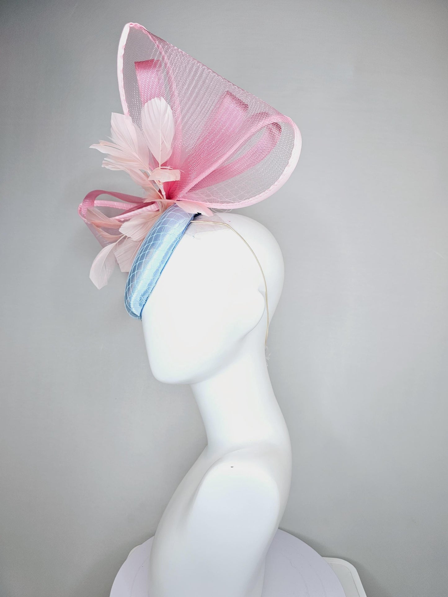 kentucky derby hat fascinator light baby blue satin with netting, branching light blush pink feathers and large mesh blush pink bow