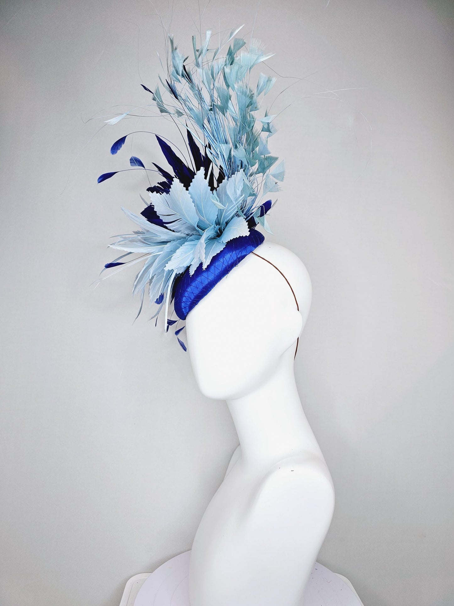 kentucky derby hat fascinator royal blue satin with netting, aqua turquoise navy blue feather flower, light teal blue branching feathers