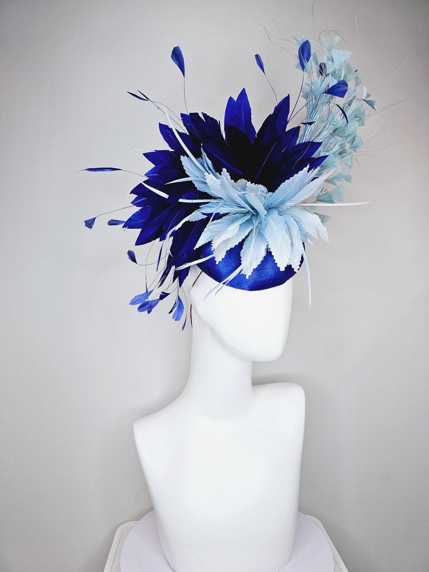 kentucky derby hat fascinator royal blue satin with netting, aqua turquoise navy blue feather flower, light teal blue branching feathers