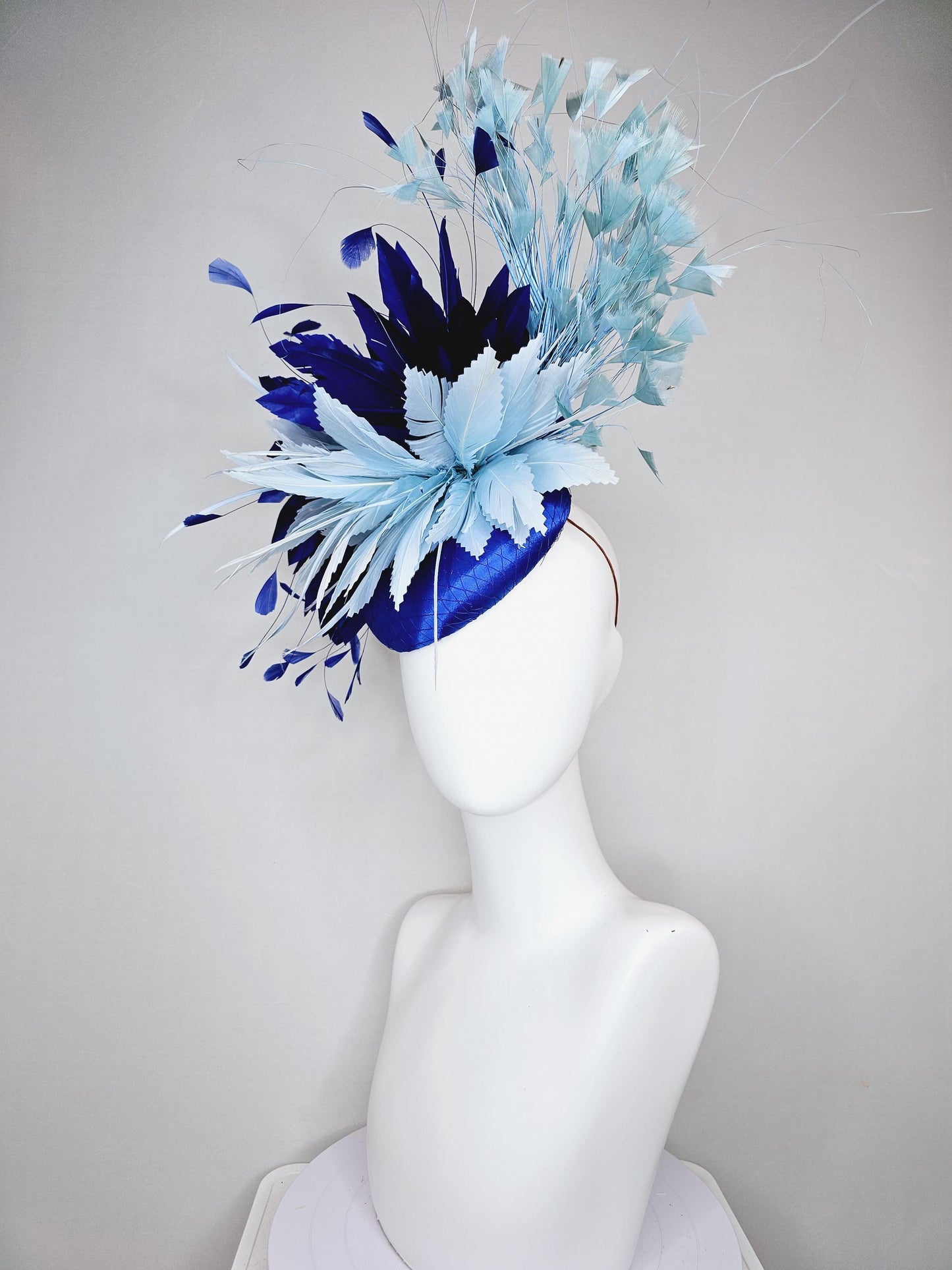 kentucky derby hat fascinator royal blue satin with netting, aqua turquoise navy blue feather flower, light teal blue branching feathers