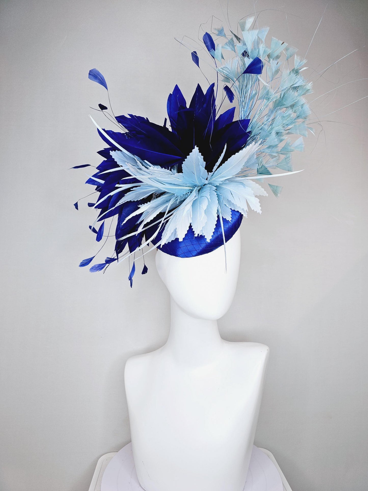 kentucky derby hat fascinator royal blue satin with netting, aqua turquoise navy blue feather flower, light teal blue branching feathers