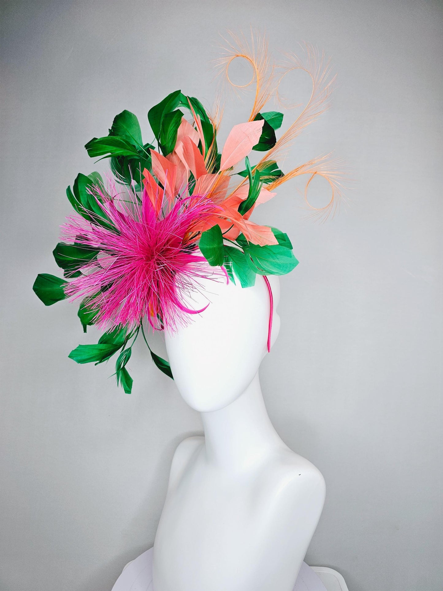 kentucky derby hat fascinator pink spiky feather flower, light orange peach, emerald green branching feathers and light peach feather curls