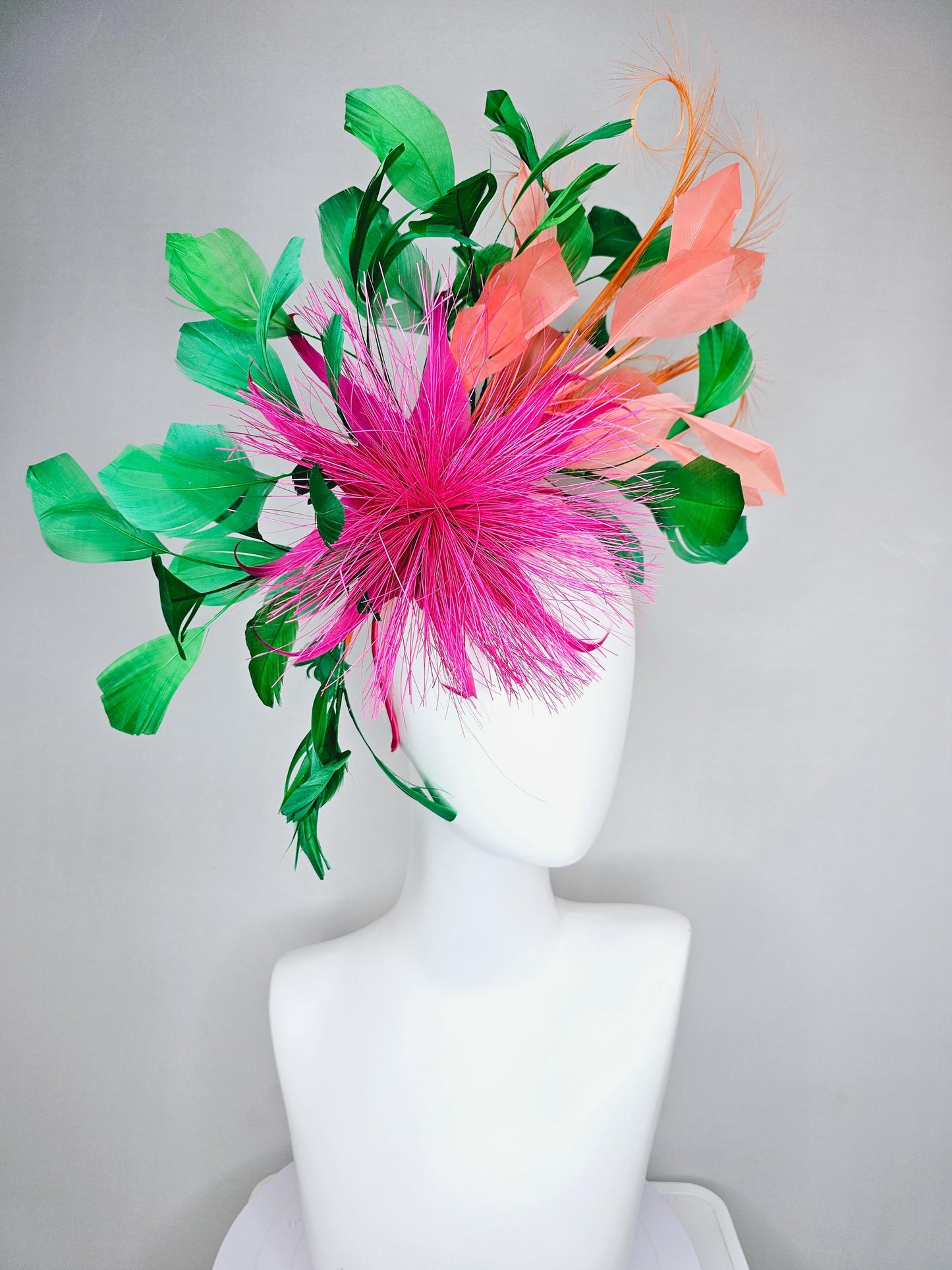 kentucky derby hat fascinator pink spiky feather flower, light orange peach, emerald green branching feathers and light peach feather curls