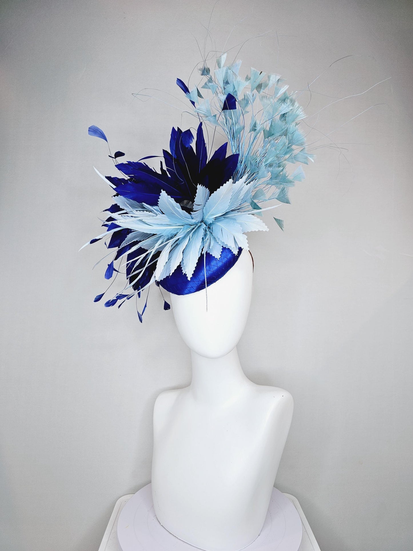 kentucky derby hat fascinator royal blue satin with netting, aqua turquoise navy blue feather flower, light teal blue branching feathers