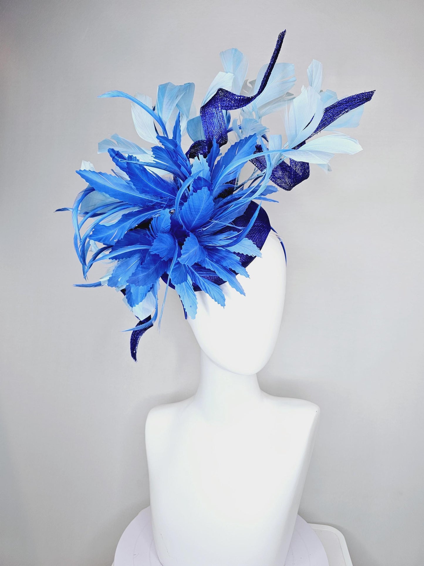 kentucky derby hat fascinator navy blue sinamay, fluffy royal blue zigzag feathers, navy blue sinamay curls, light blue branching feathers