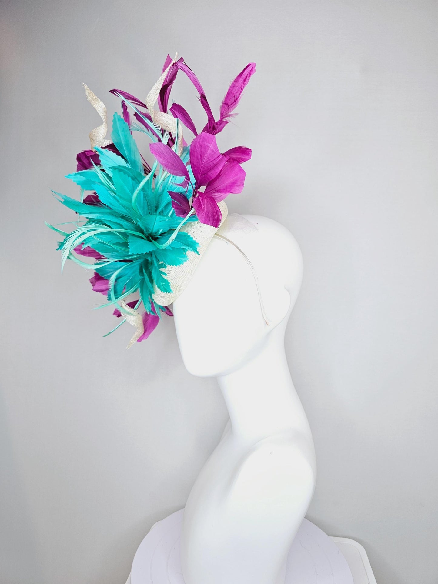 kentucky derby hat fascinator white sinamay, fluffy aqua blue green zigzag feathers, white sinamay curls, magenta purple branching feathers