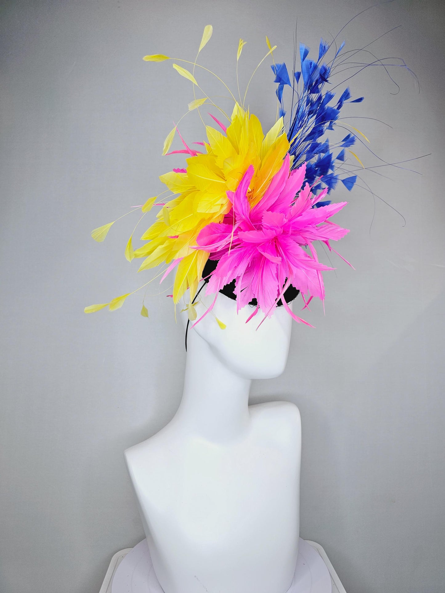 kentucky derby hat fascinator black satin with netting, pink and yellow feather flower, cobalt royal blue branching feathers