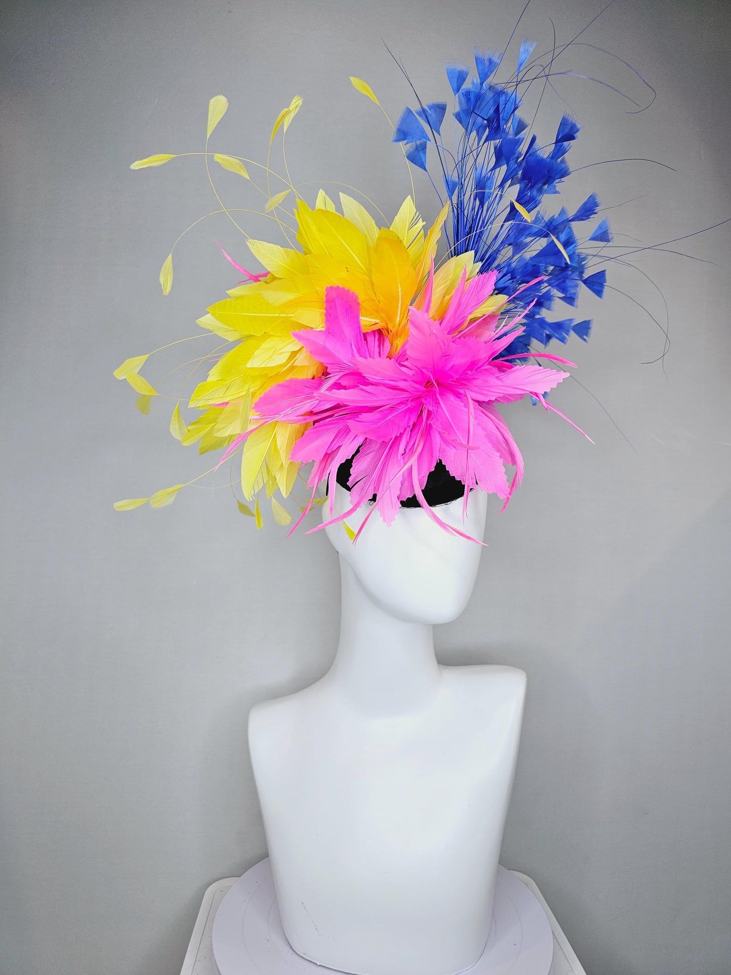 kentucky derby hat fascinator black satin with netting, pink and yellow feather flower, cobalt royal blue branching feathers