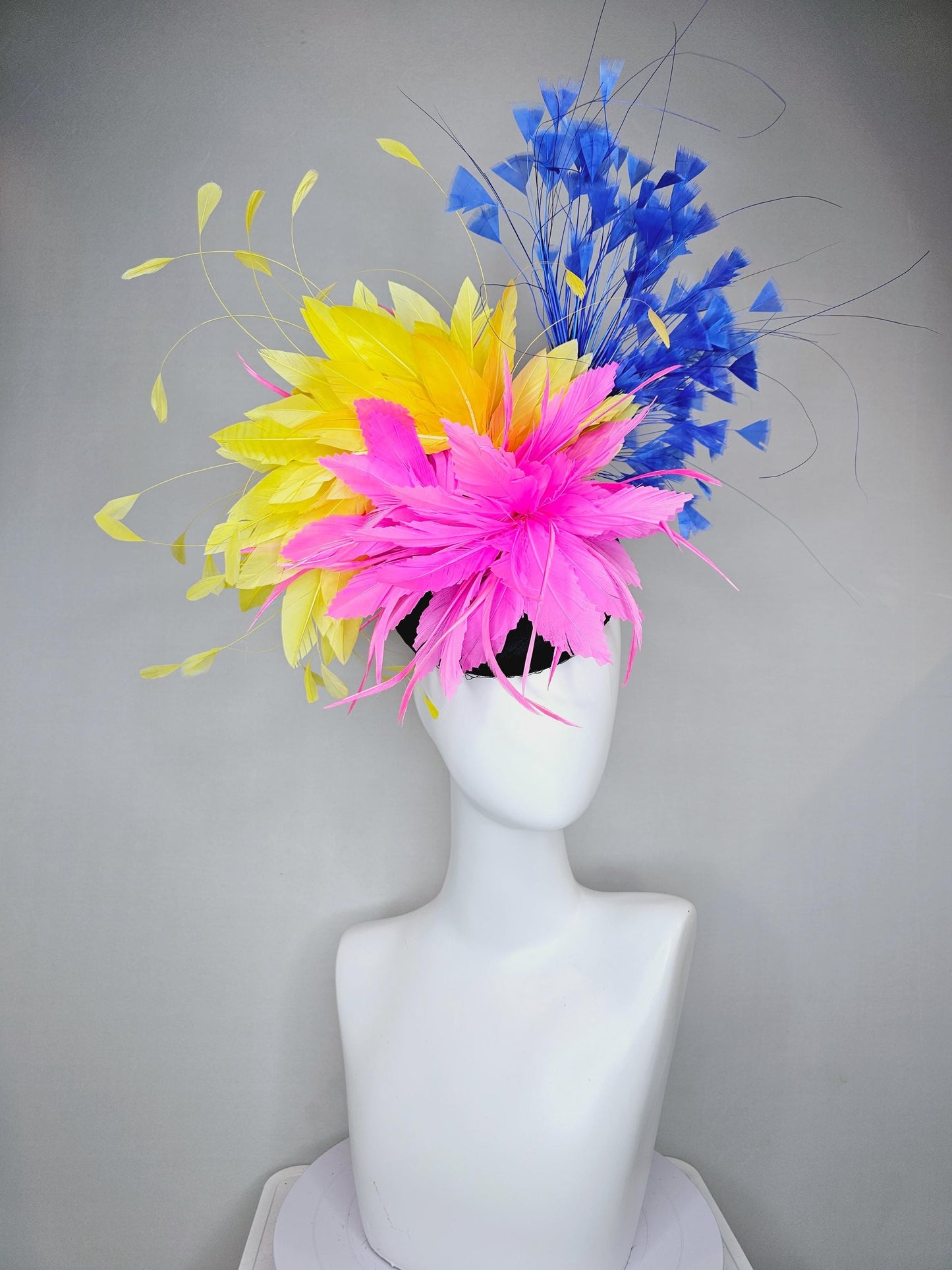 kentucky derby hat fascinator black satin with netting, pink and yellow feather flower, cobalt royal blue branching feathers