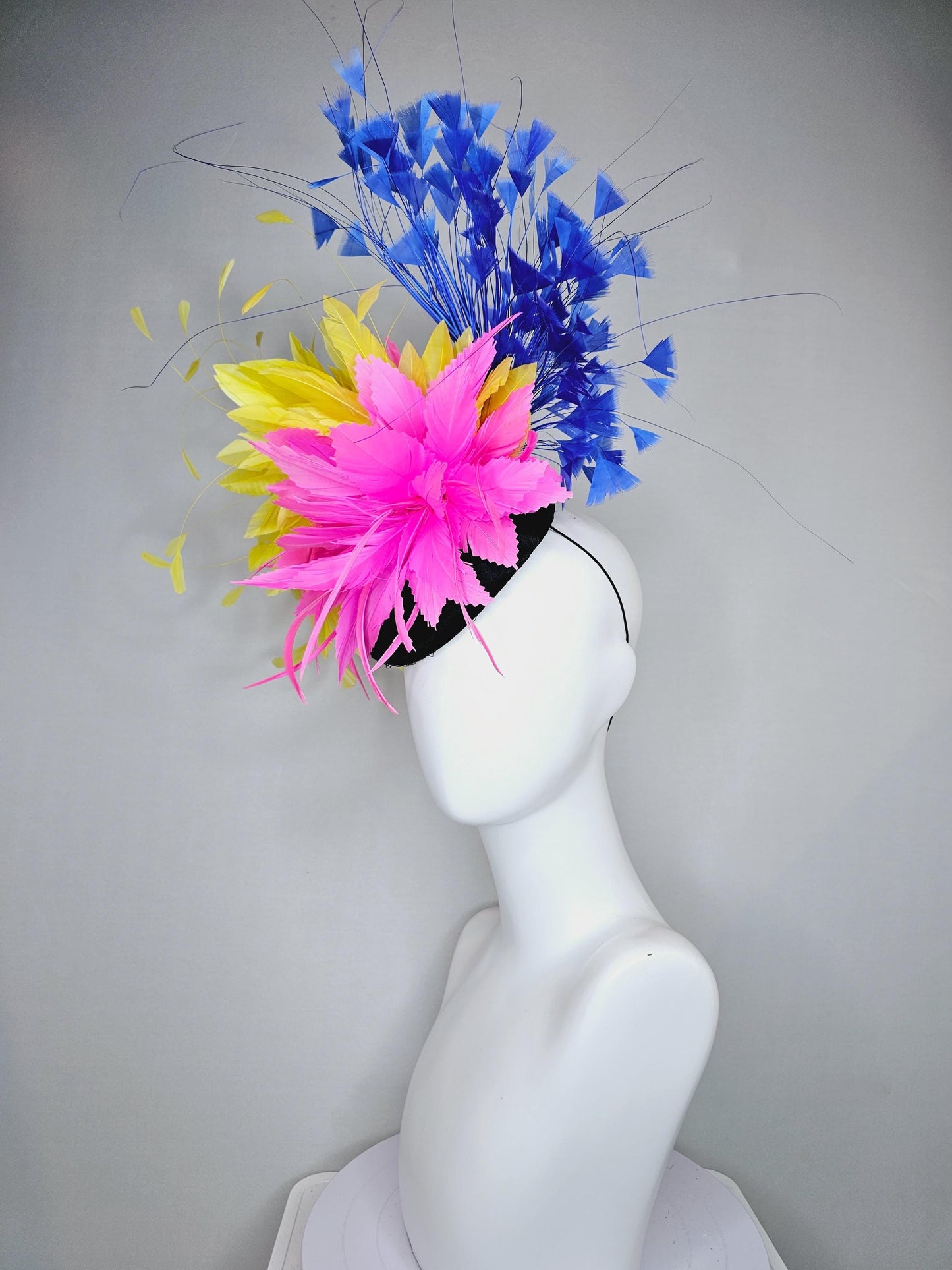 kentucky derby hat fascinator black satin with netting, pink and yellow feather flower, cobalt royal blue branching feathers