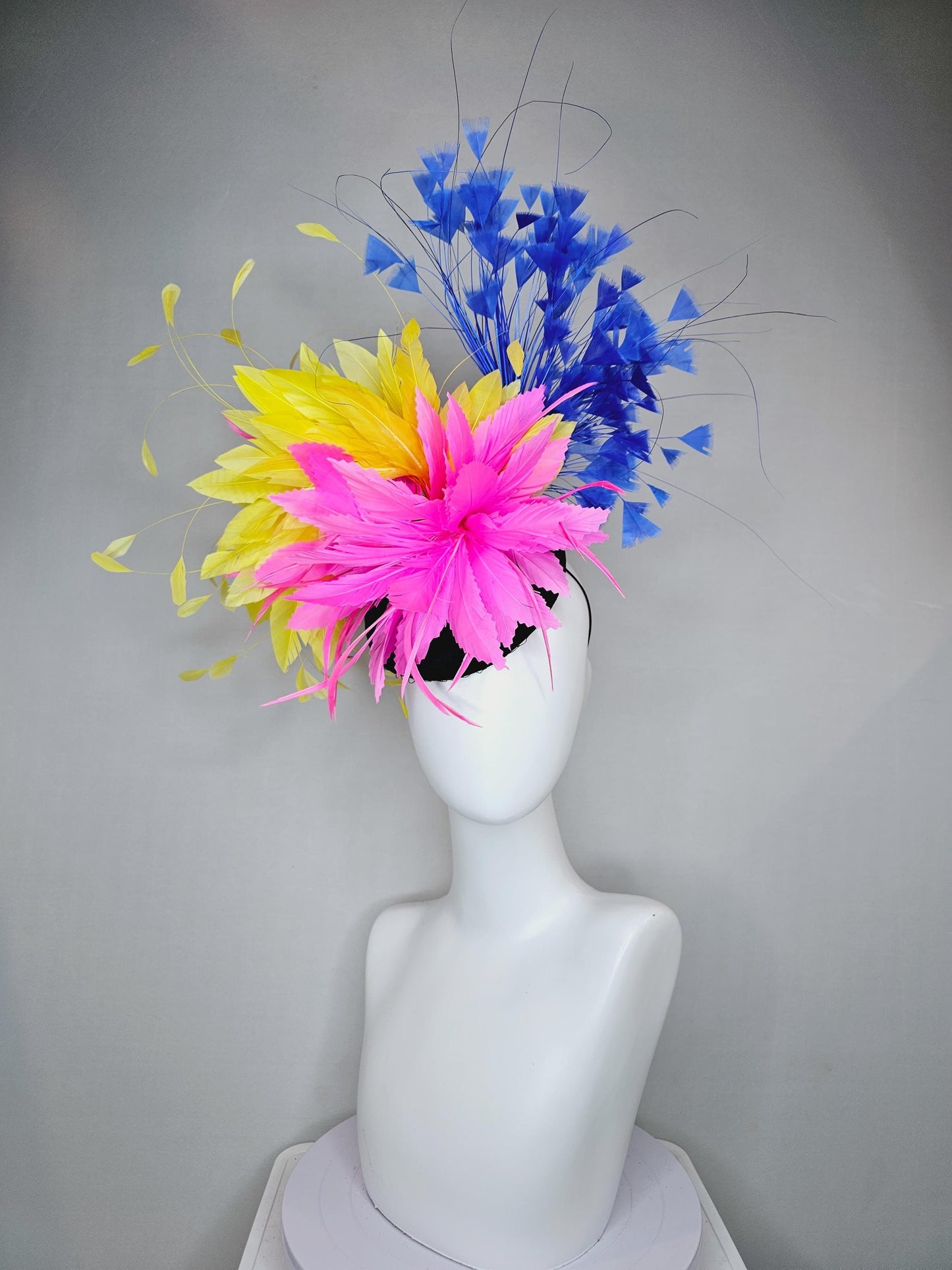 kentucky derby hat fascinator black satin with netting, pink and yellow feather flower, cobalt royal blue branching feathers