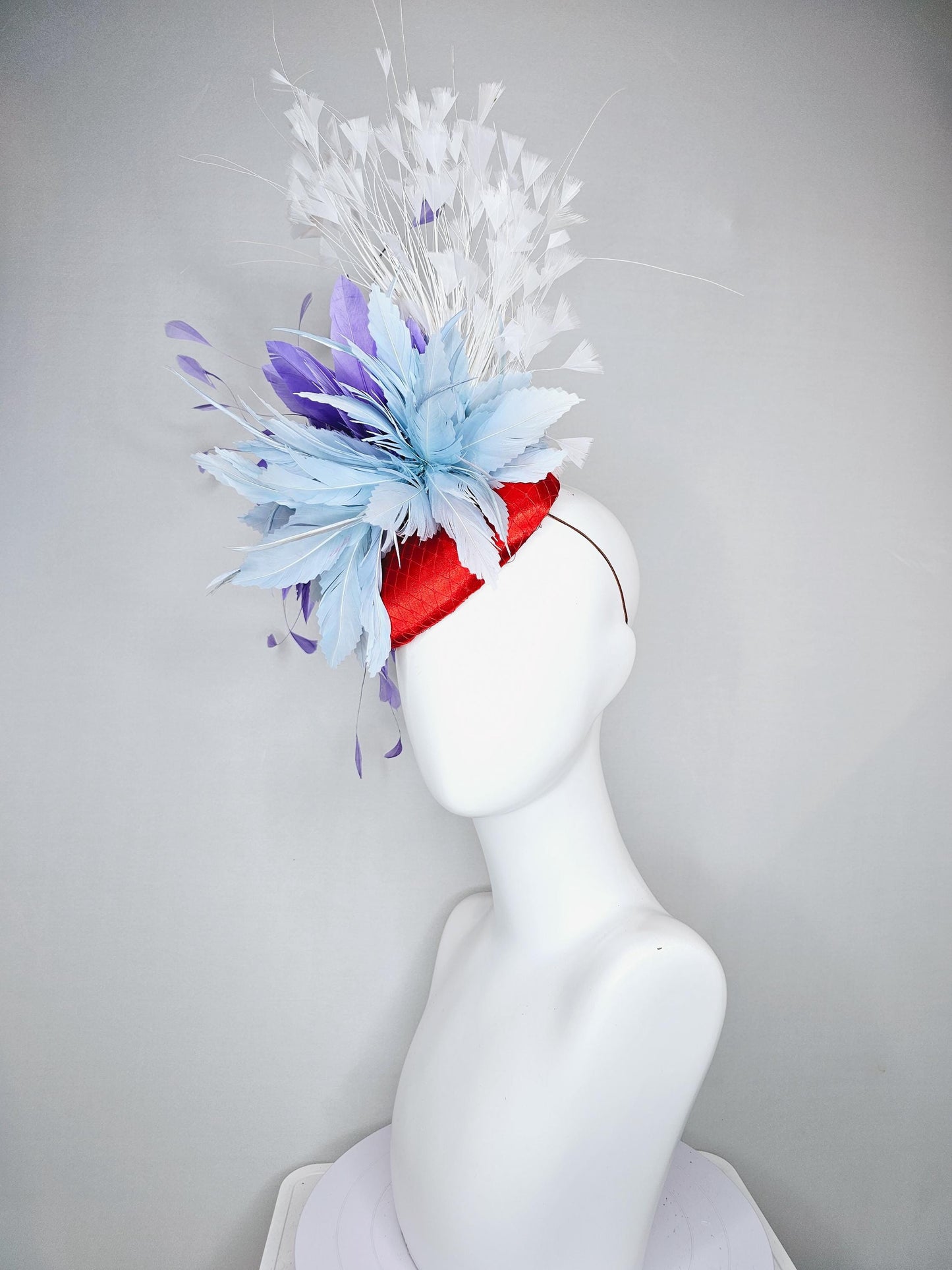 kentucky derby hat fascinator red satin with netting, light teal baby blue and purple lavender feather flower, white branching feathers