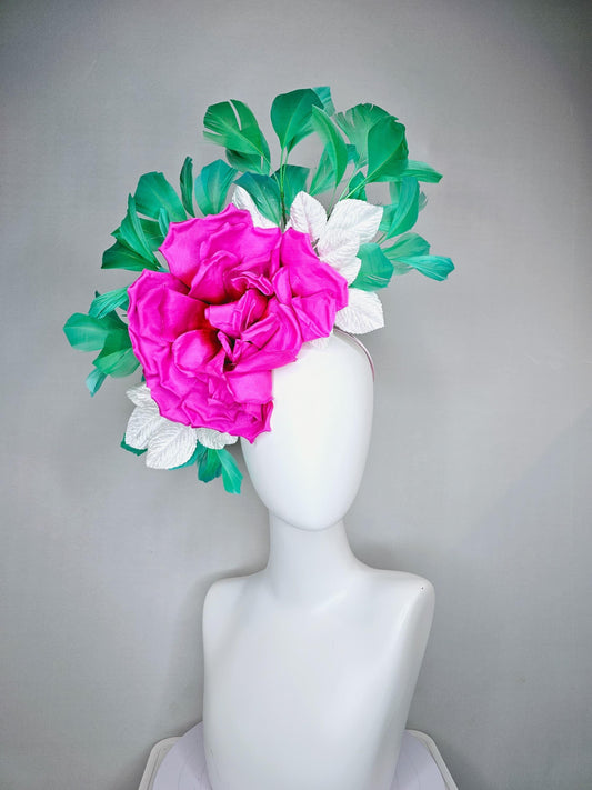 kentucky derby hat fascinator with bright pink fuchsia satin silk flower with white leaves and green branching feathers