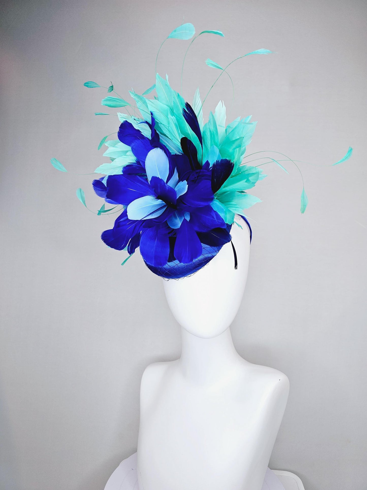 kentucky derby hat fascinator cobalt blue satin with netting and fluffy cobalt blue, light blue,navy blue,aqua blue green branching feathers