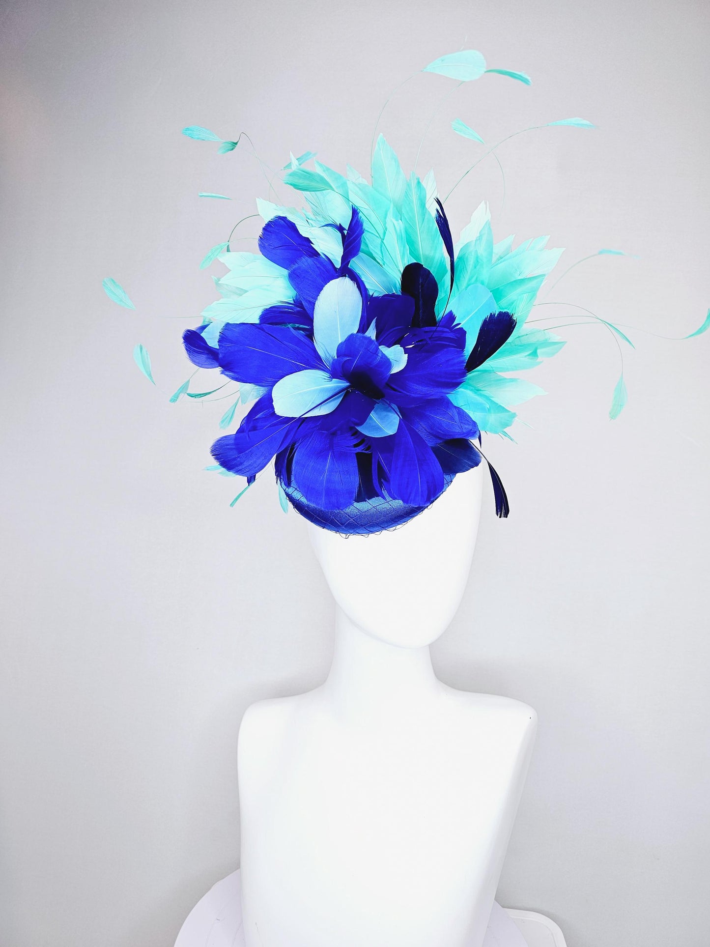 kentucky derby hat fascinator cobalt blue satin with netting and fluffy cobalt blue, light blue,navy blue,aqua blue green branching feathers