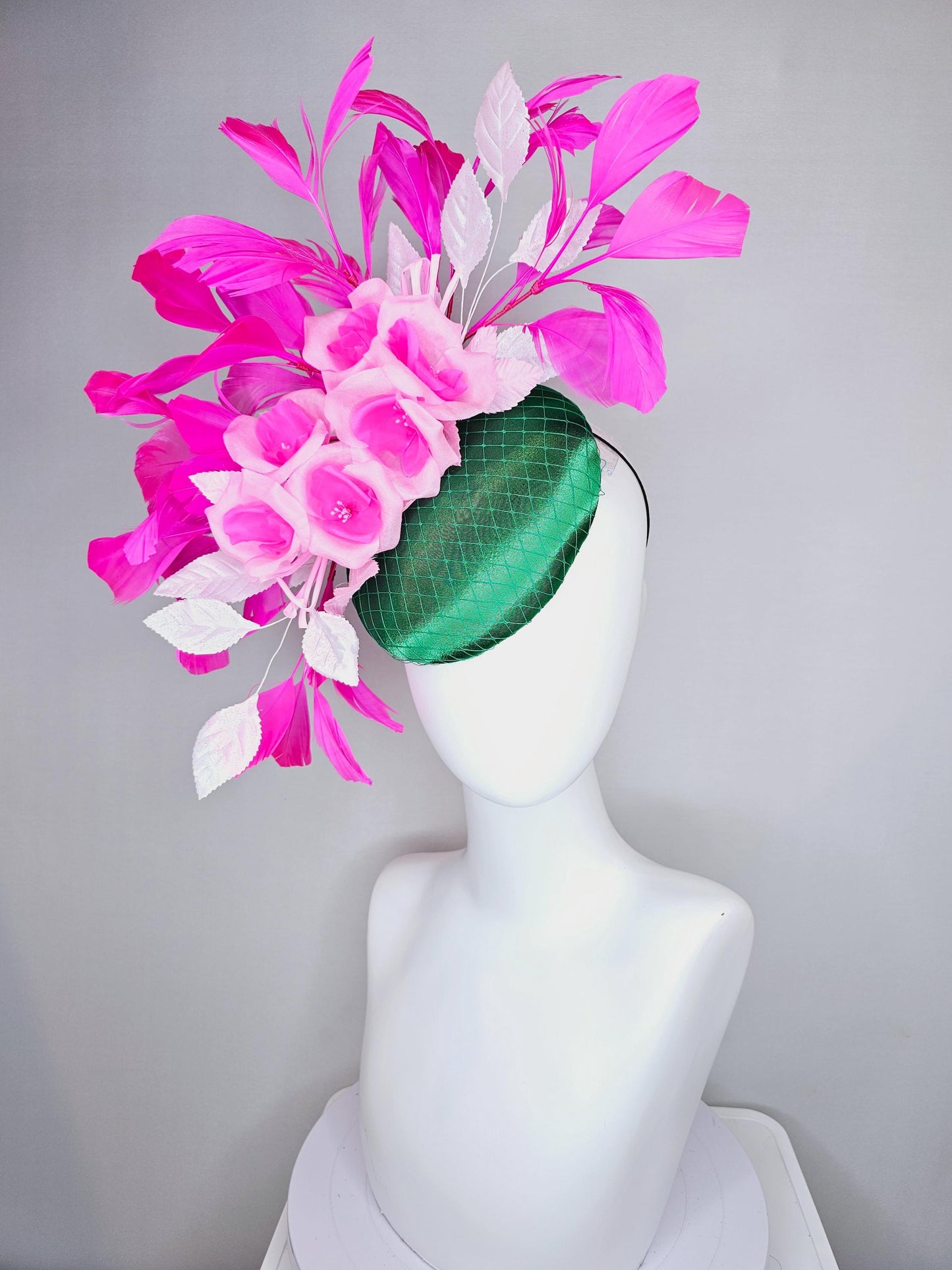 kentucky derby hat fascinator green satin with netting, blush pink satin flowers, light pink leaves, bright pink fuchsia branching feathers