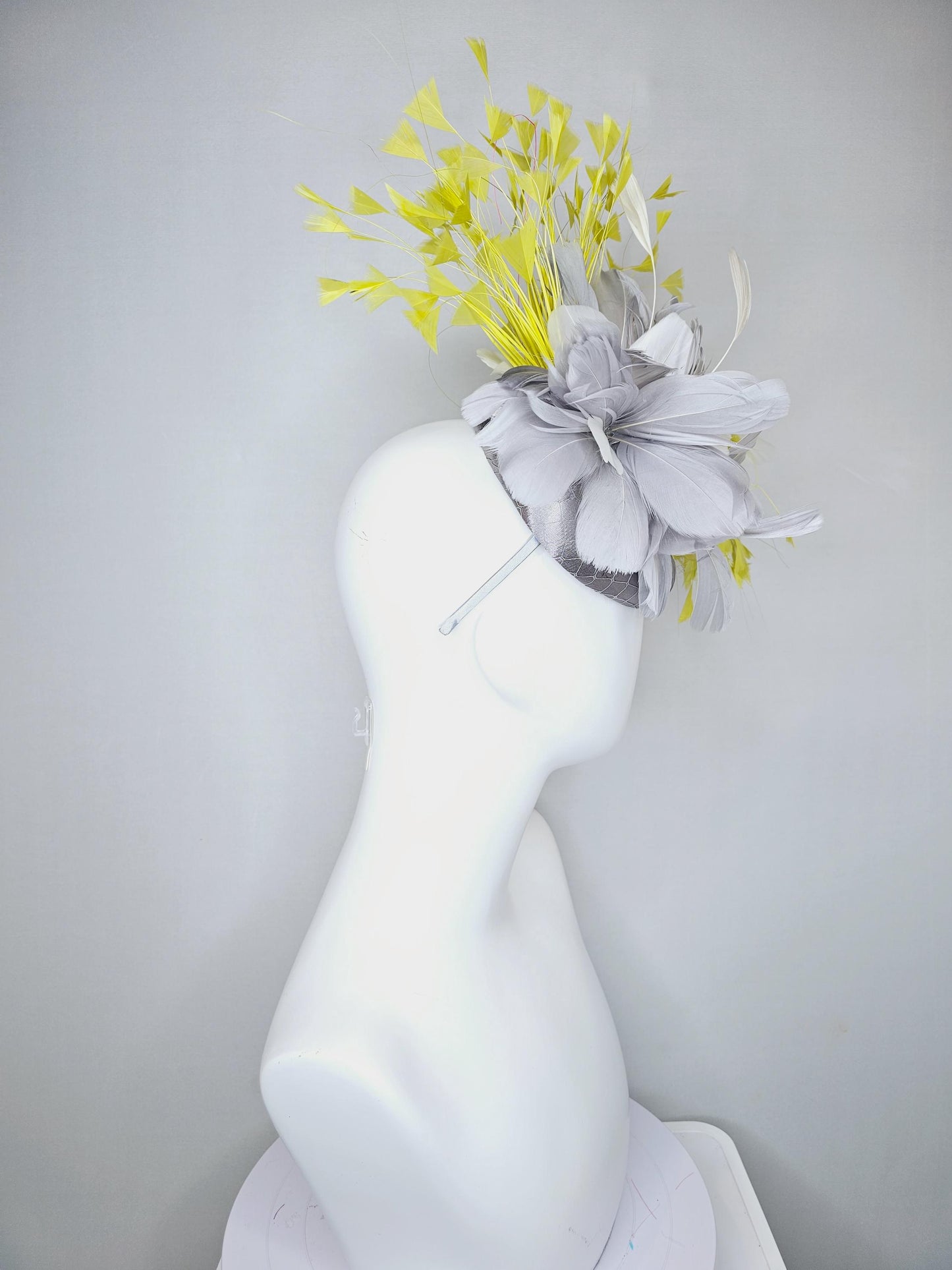 kentucky derby hat fascinator silver gray satin with netting and silver gray, mustard yellow branching feathers