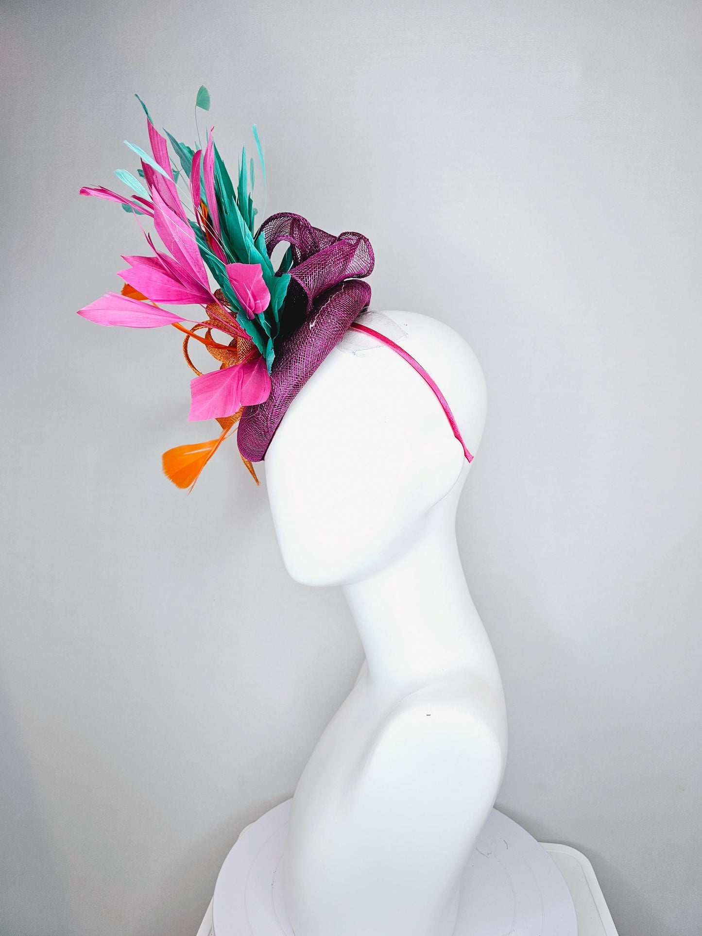 kentucky derby hat fascinator magenta purple sinamay with orange sinamay bow and orange feathers,pink and aqua blue green branching feathers