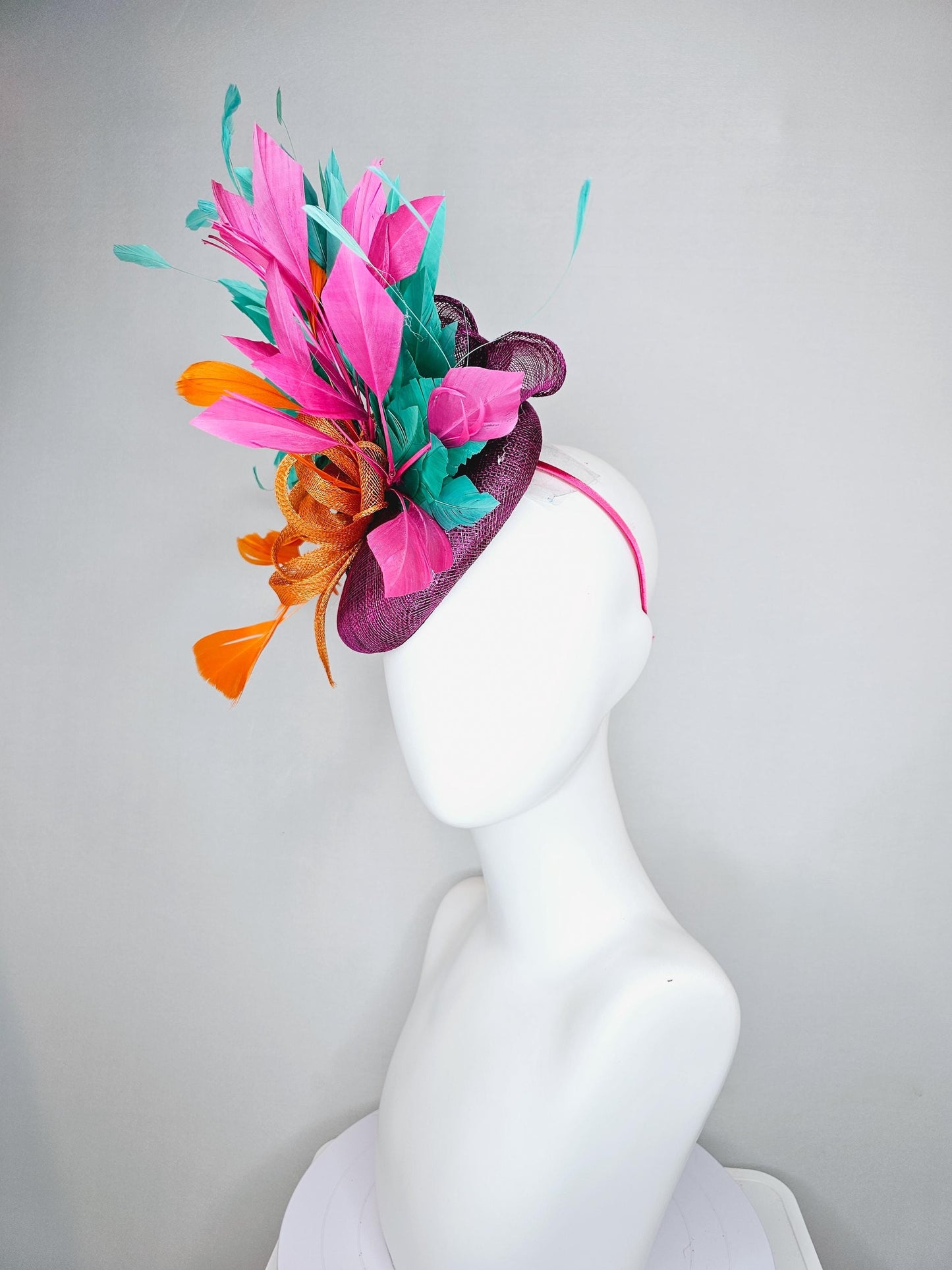 kentucky derby hat fascinator magenta purple sinamay with orange sinamay bow and orange feathers,pink and aqua blue green branching feathers