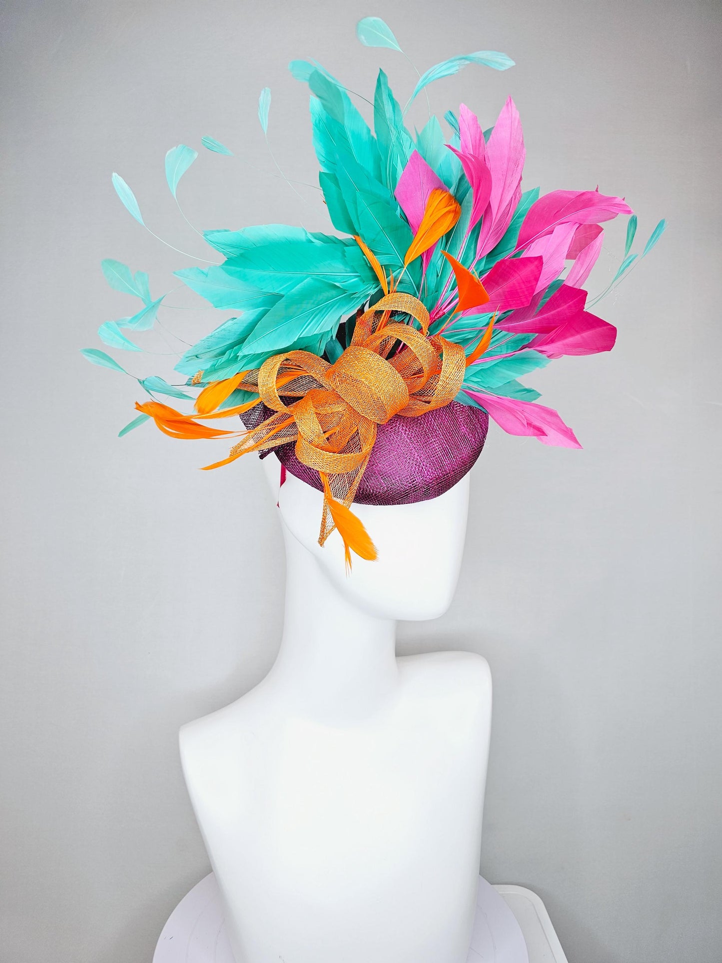 kentucky derby hat fascinator magenta purple sinamay with orange sinamay bow and orange feathers,pink and aqua blue green branching feathers